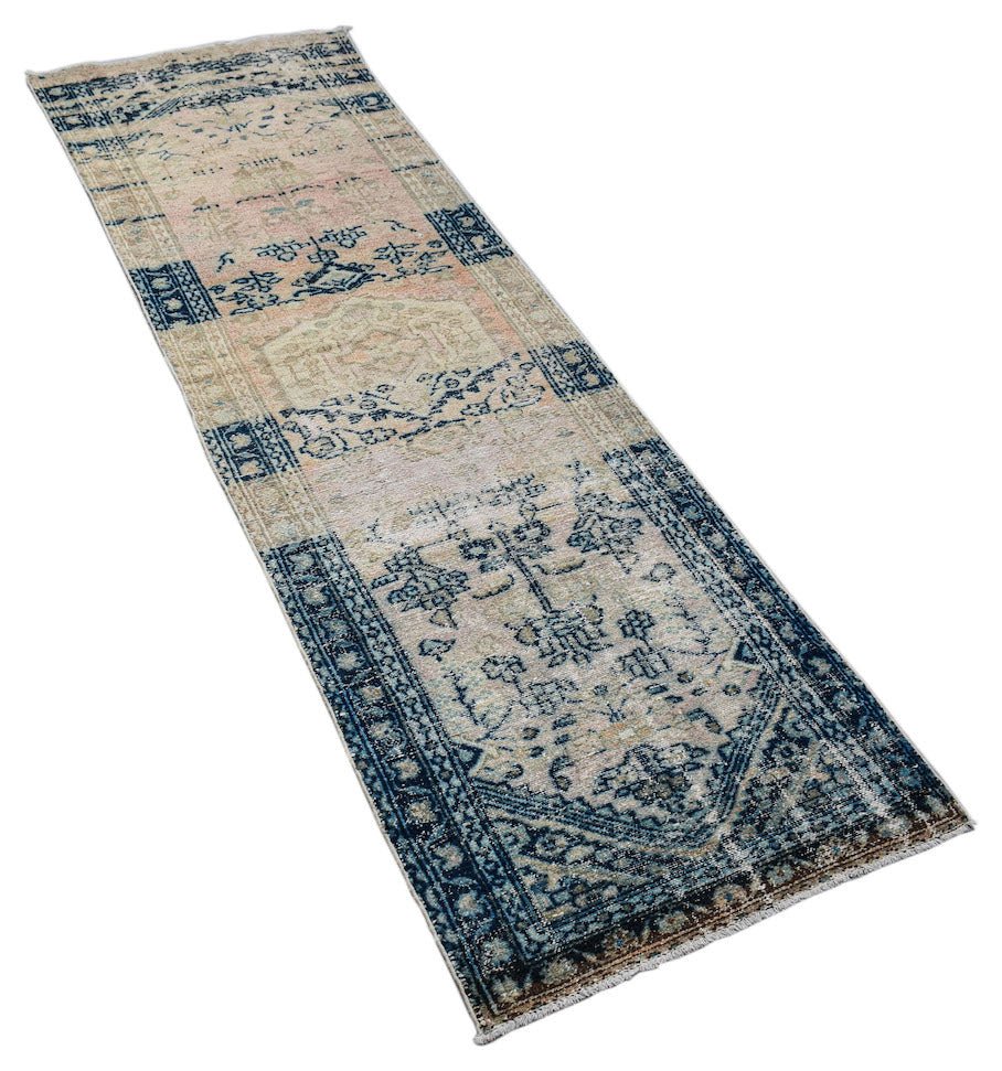 A vintage Persian Hamadan runner rug featuring a distressed blue and beige patterned design.