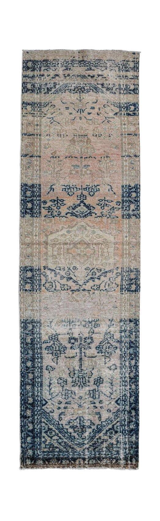 A vintage handwoven Persian Hamadan runner featuring a faded blue and beige floral pattern.