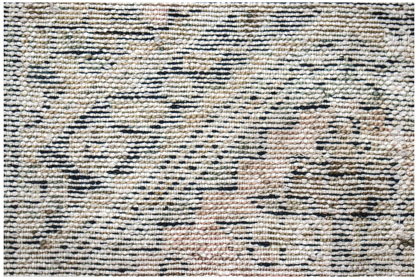 Close-up of a vintage Persian Hamadan runner featuring a textured wool weave with faded patterns.