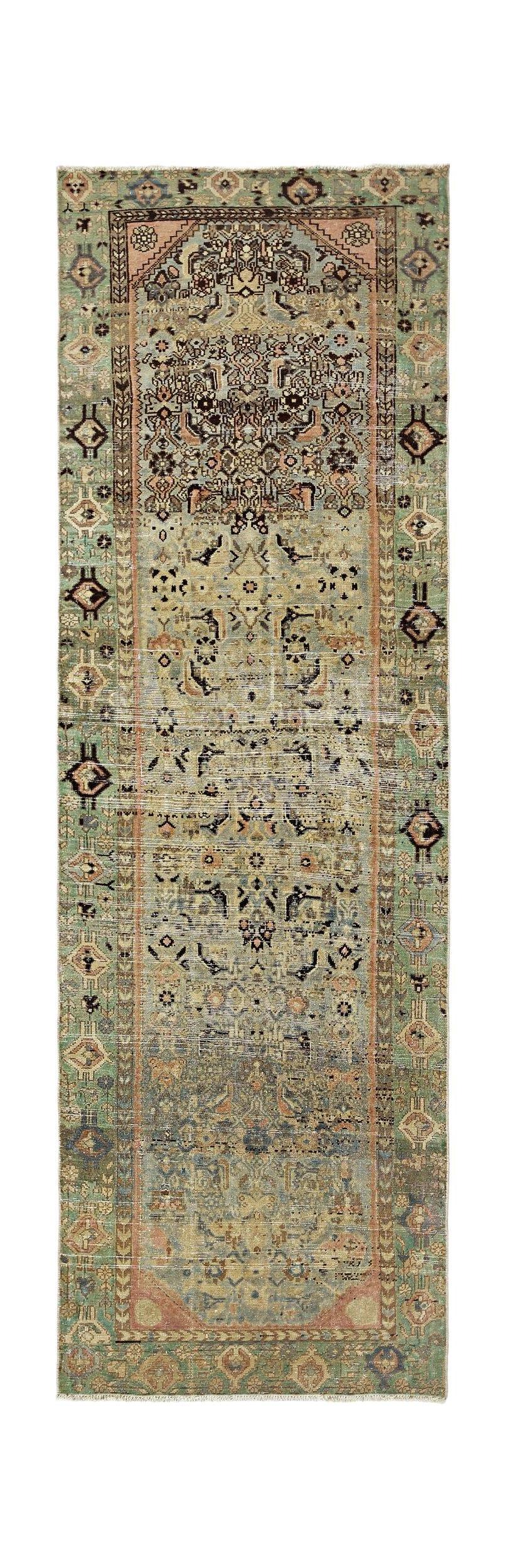 A vintage Persian runner featuring intricate floral patterns in muted green, blue, and pink tones.