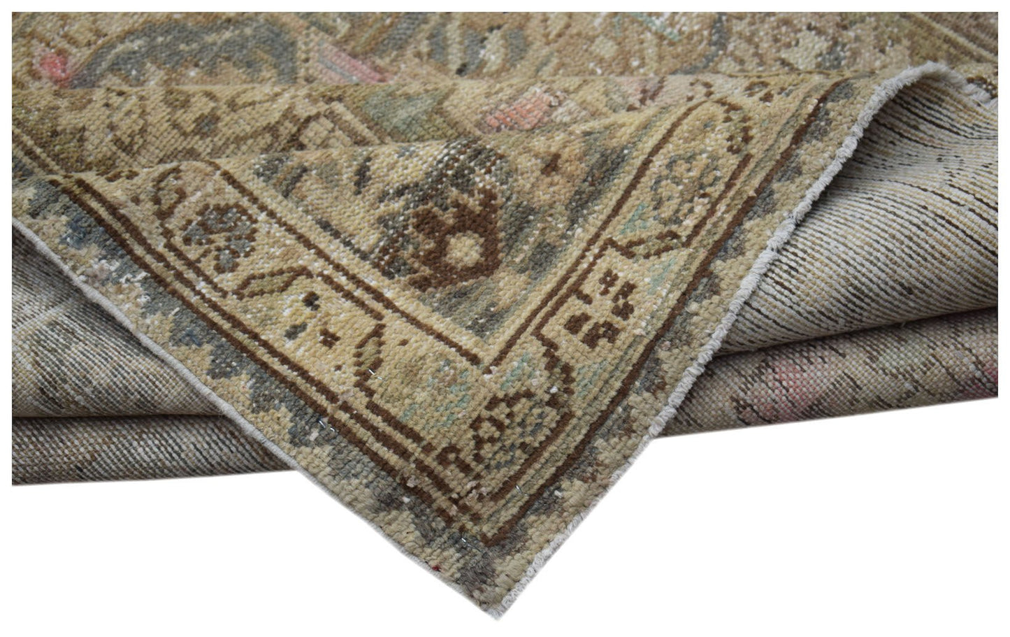 A handwoven vintage Persian runner featuring a faded floral pattern in muted earth tones.