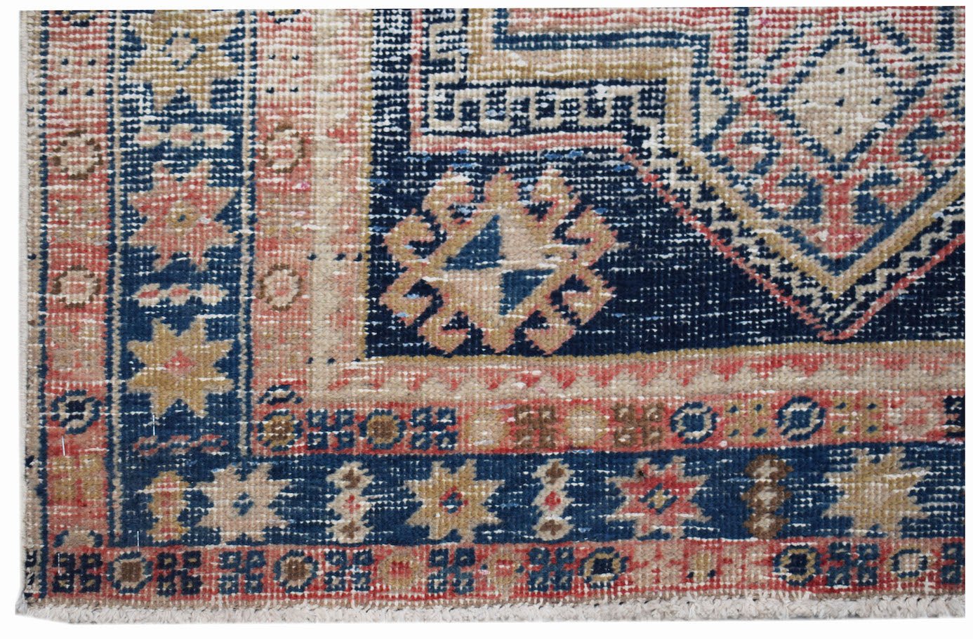 A vintage Persian runner featuring a geometric pattern in shades of blue, red, and beige.