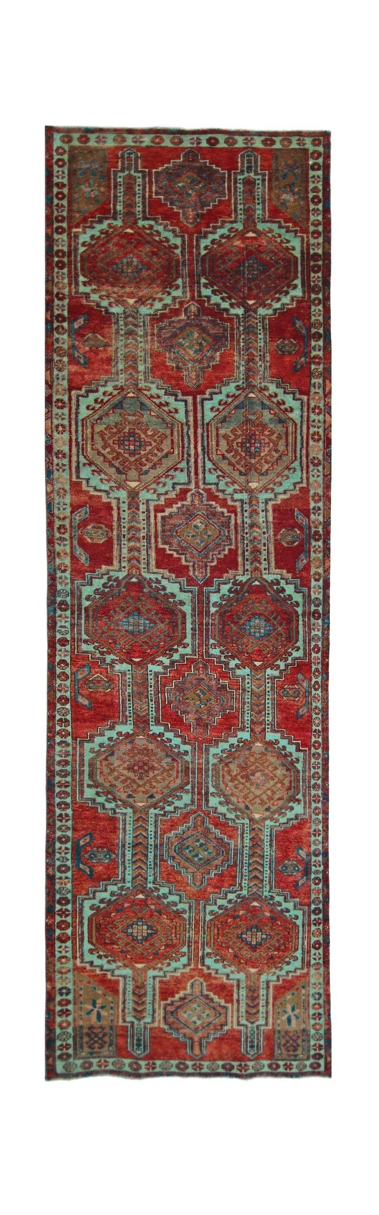 A vintage Persian Hamadan runner featuring geometric medallions in red and teal wool.