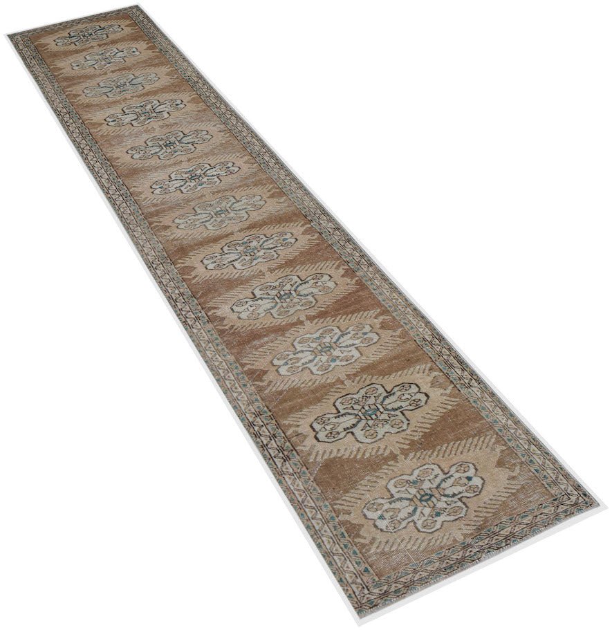 Vintage Persian Tabriz runner with a repeating floral pattern in brown and cream.