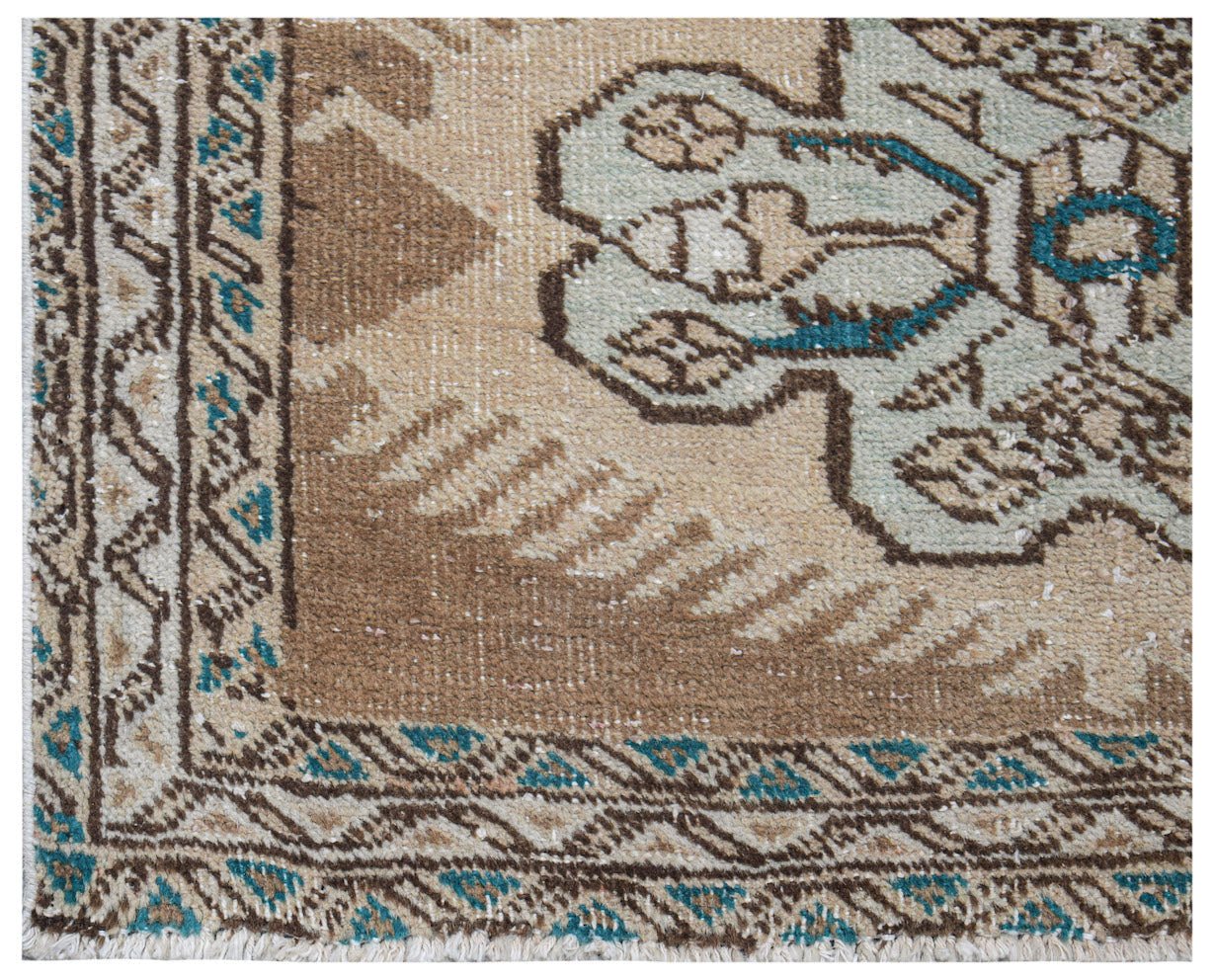 Vintage Persian Tabriz runner with intricate geometric patterns in brown, beige, and teal.