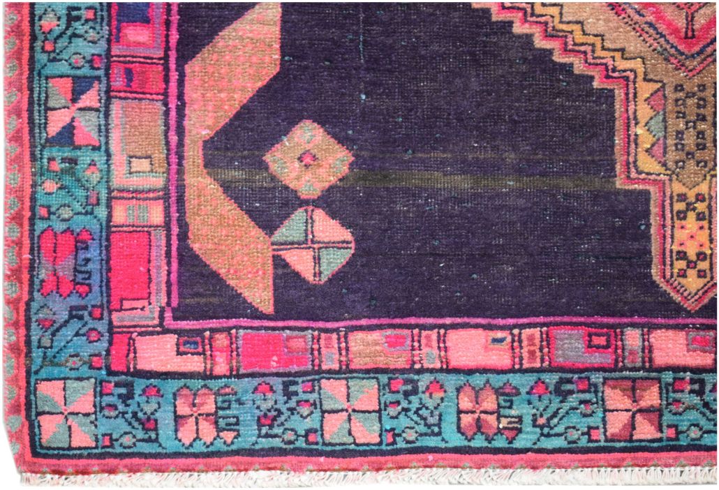 A vintage Persian Hamadan runner featuring geometric patterns in deep purple, pink, and teal.