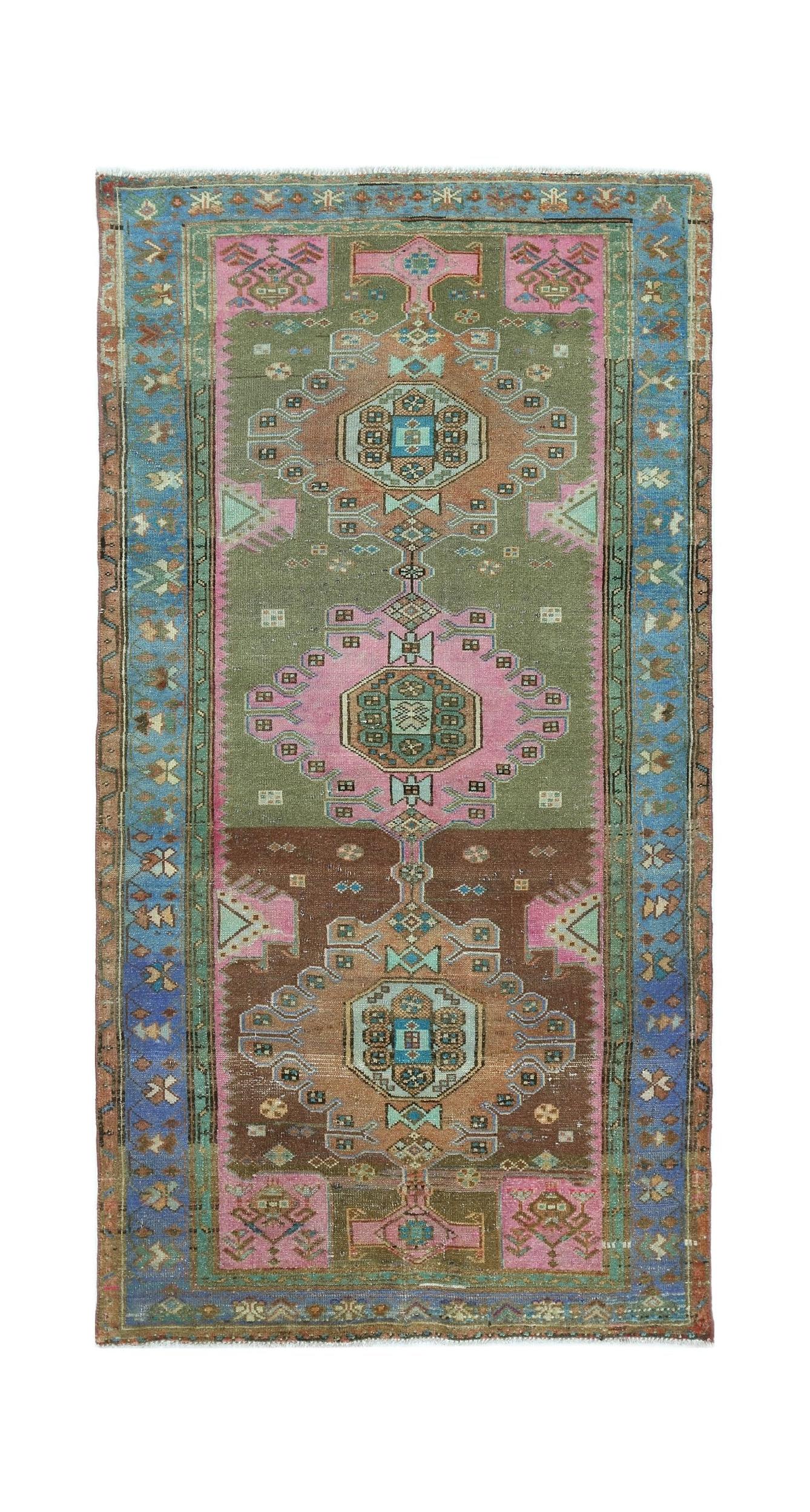 A vintage handmade Persian Hamadan rug featuring geometric medallions in olive, brown, and pink.
