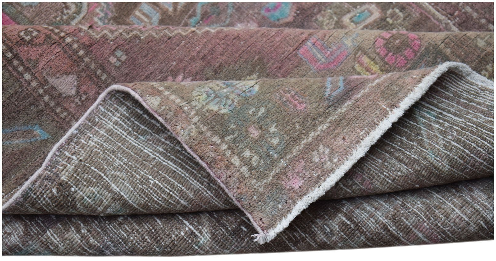 A vintage handwoven Persian Hamadan rug featuring a faded brown pattern with pink and blue accents.