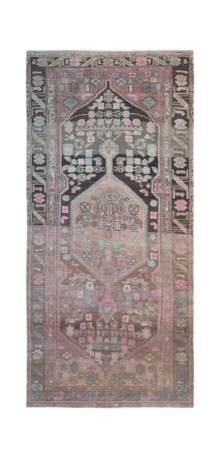 A vintage handwoven Persian Hamadan rug featuring a central medallion in muted pink and brown tones.