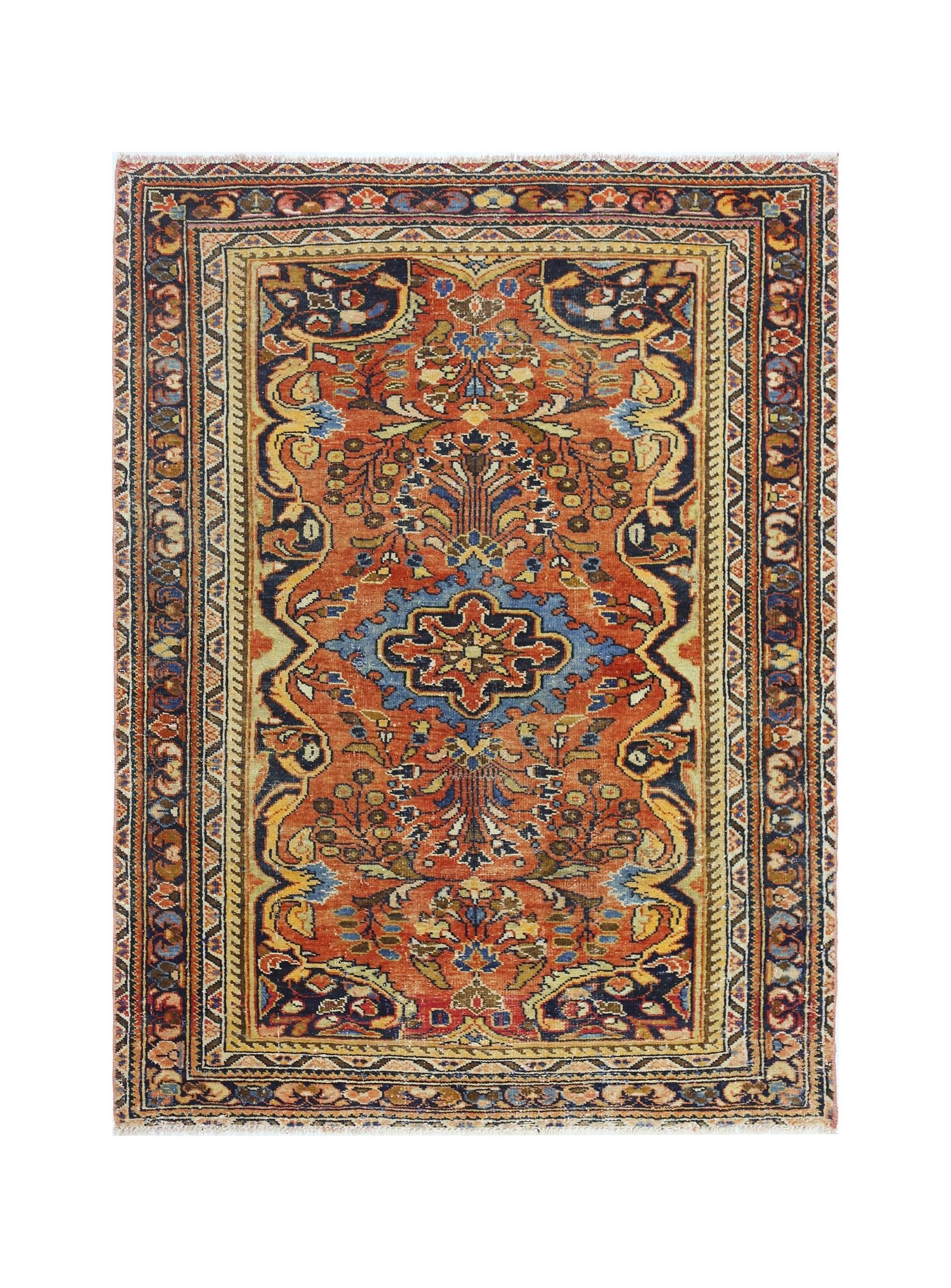 A vintage Persian Heriz rug featuring a central blue medallion on a rust-colored floral field.