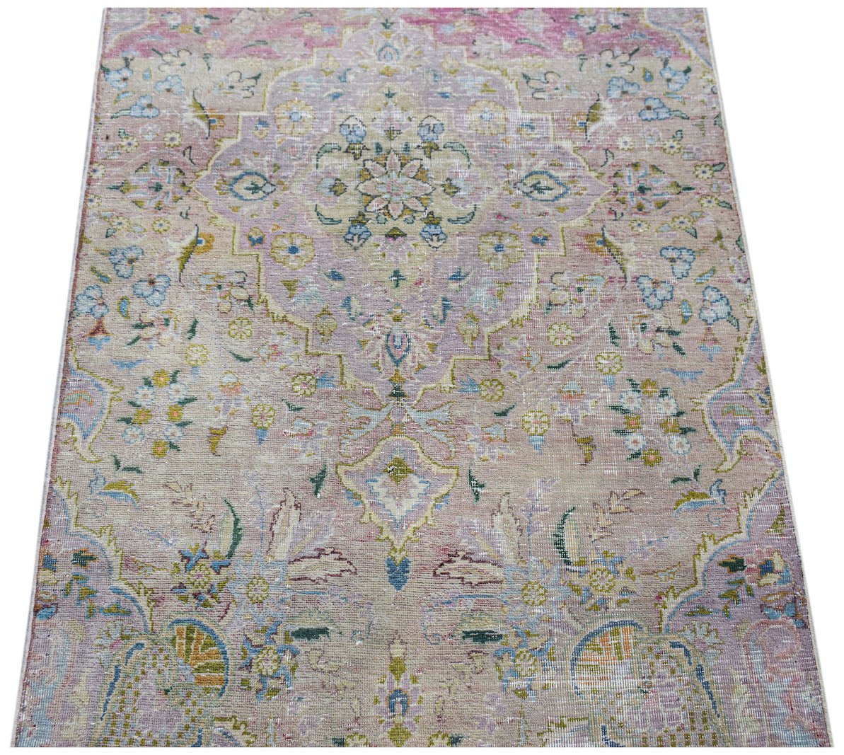 A vintage Persian Kerman runner featuring a central medallion and intricate floral patterns.