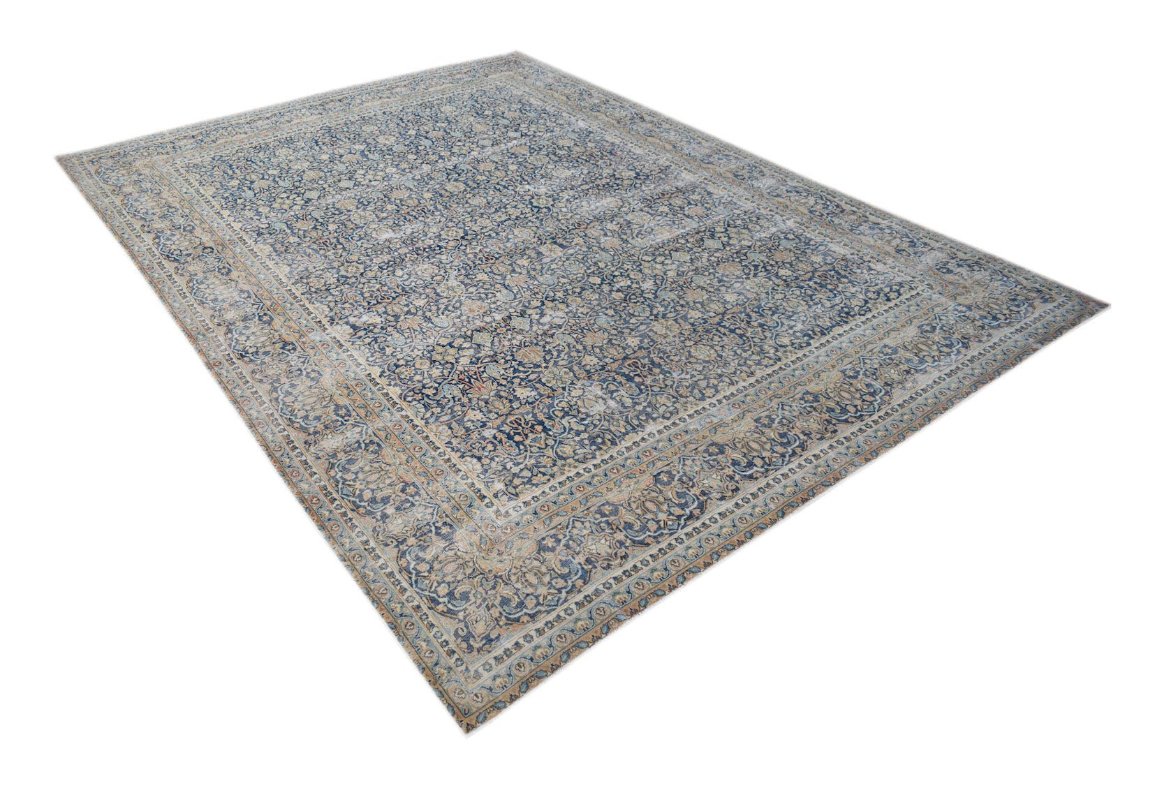 A vintage Persian Kerman rug featuring an intricate floral medallion design in blue and beige.