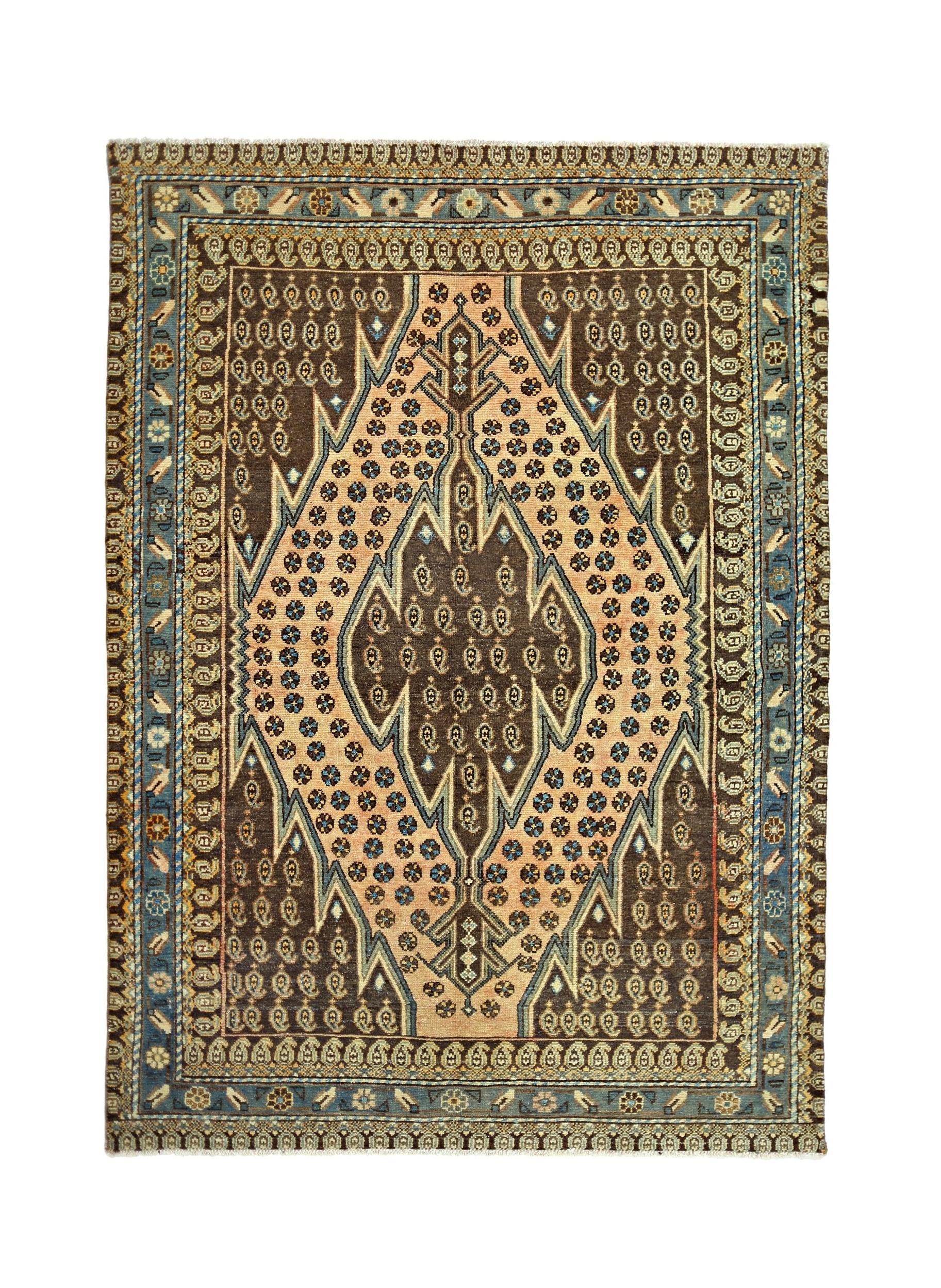 A vintage Persian Mazlaghan rug featuring a geometric diamond medallion in brown and peach tones.