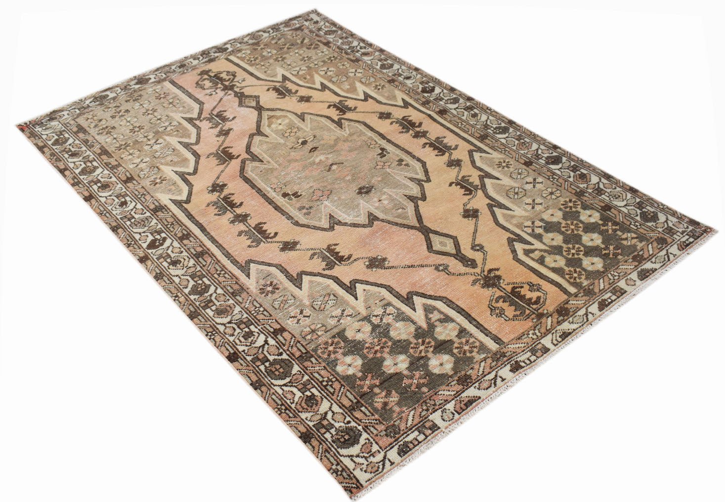 A vintage handwoven Persian Mazlaghan rug featuring a geometric medallion in muted earth tones.