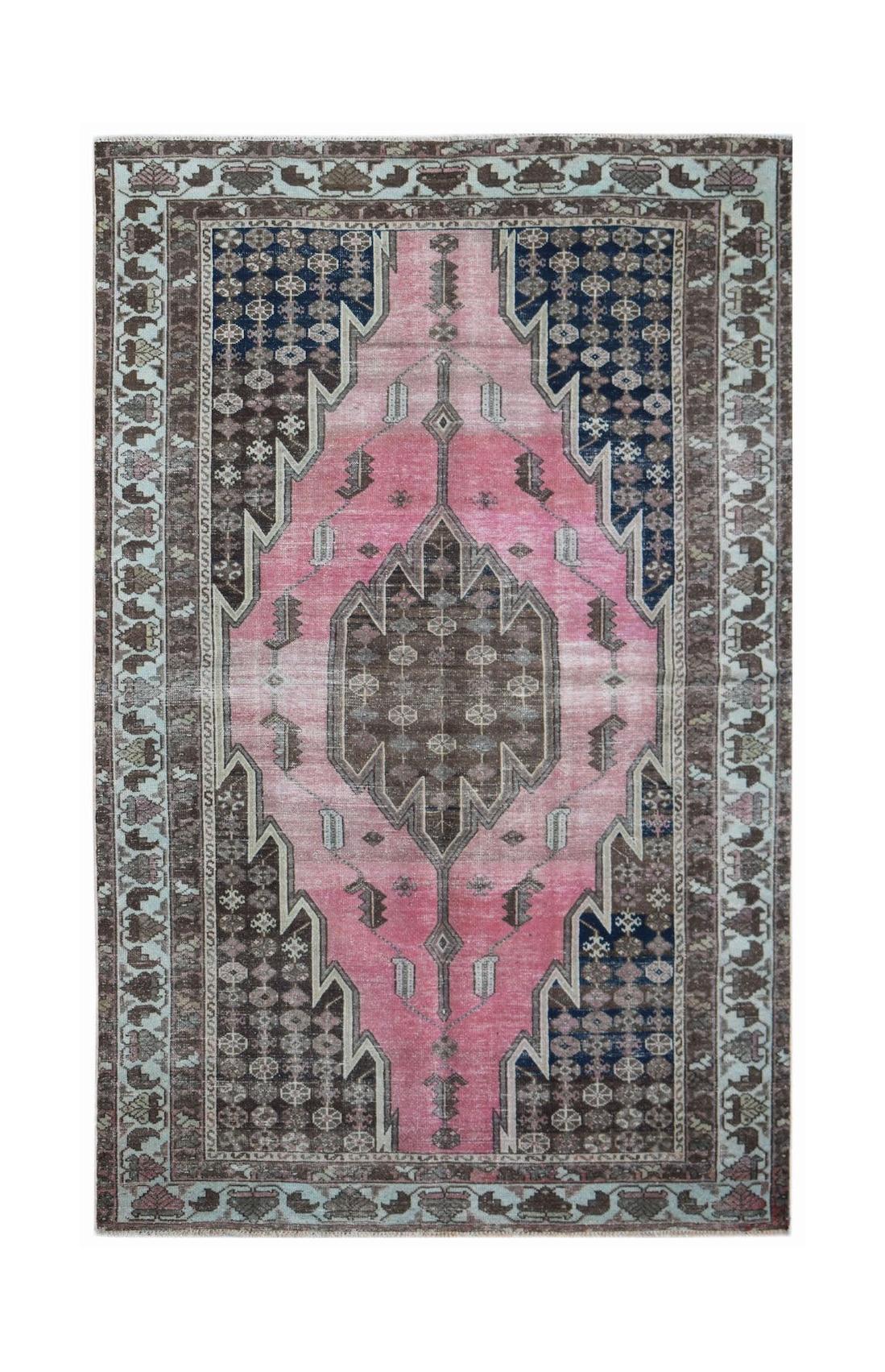 Vintage Persian Mazlaghan rug featuring a central geometric medallion in pink and dark brown.