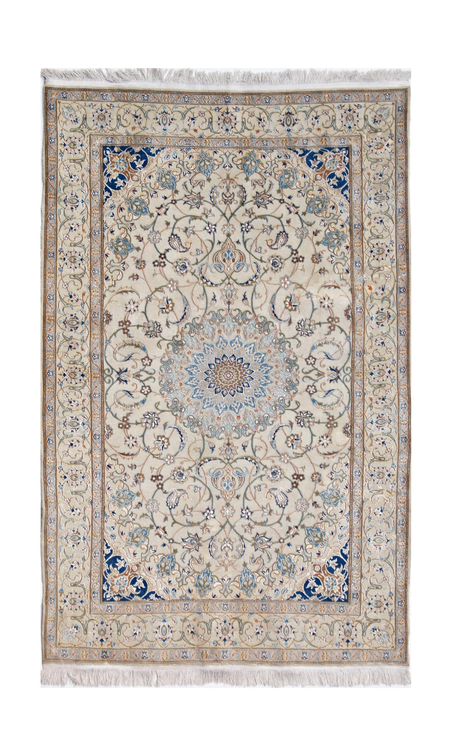 A vintage Persian Nain rug featuring a central floral medallion on a cream field with blue accents.