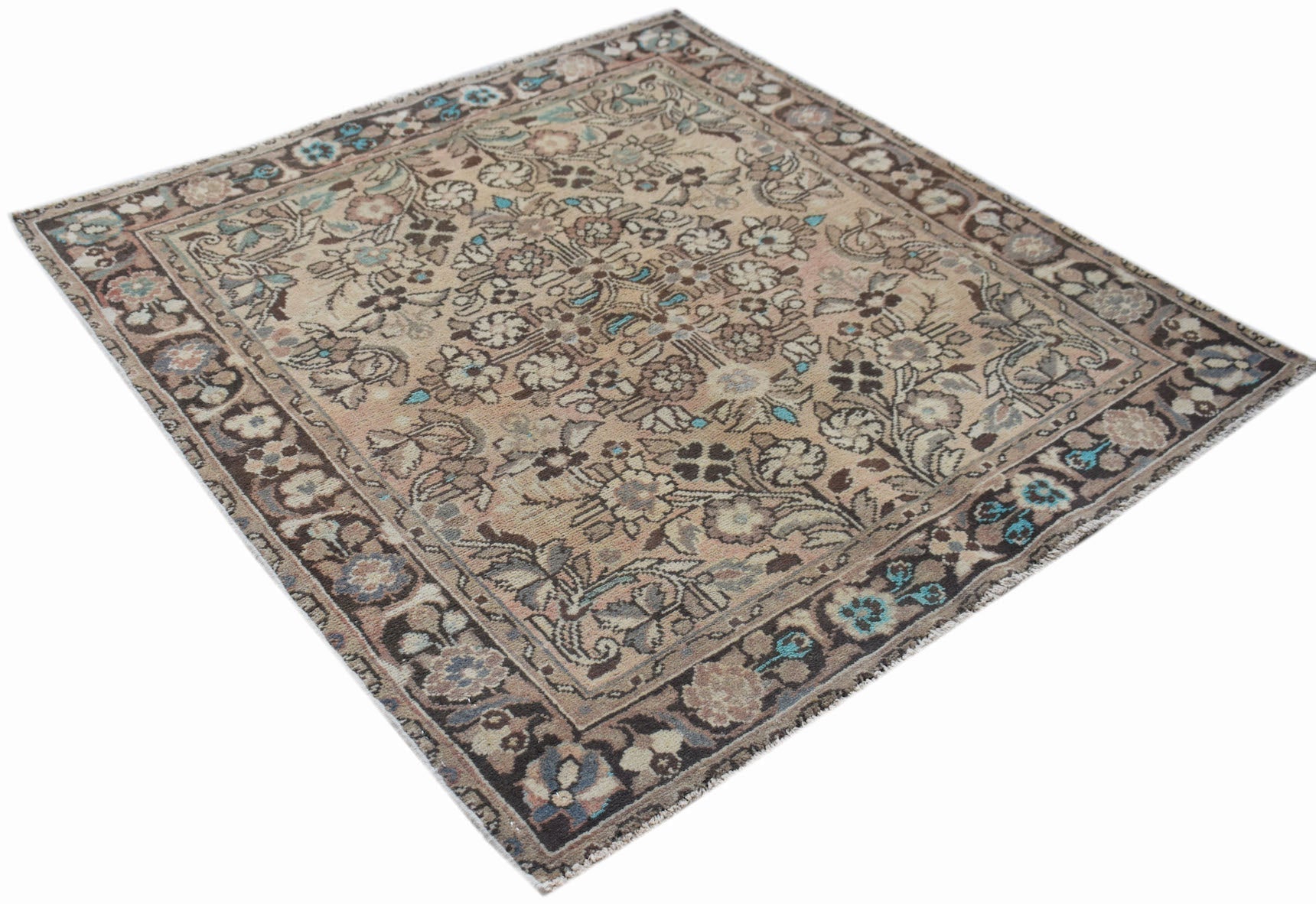 A square vintage Persian rug featuring a faded floral pattern in muted tones with blue accents.