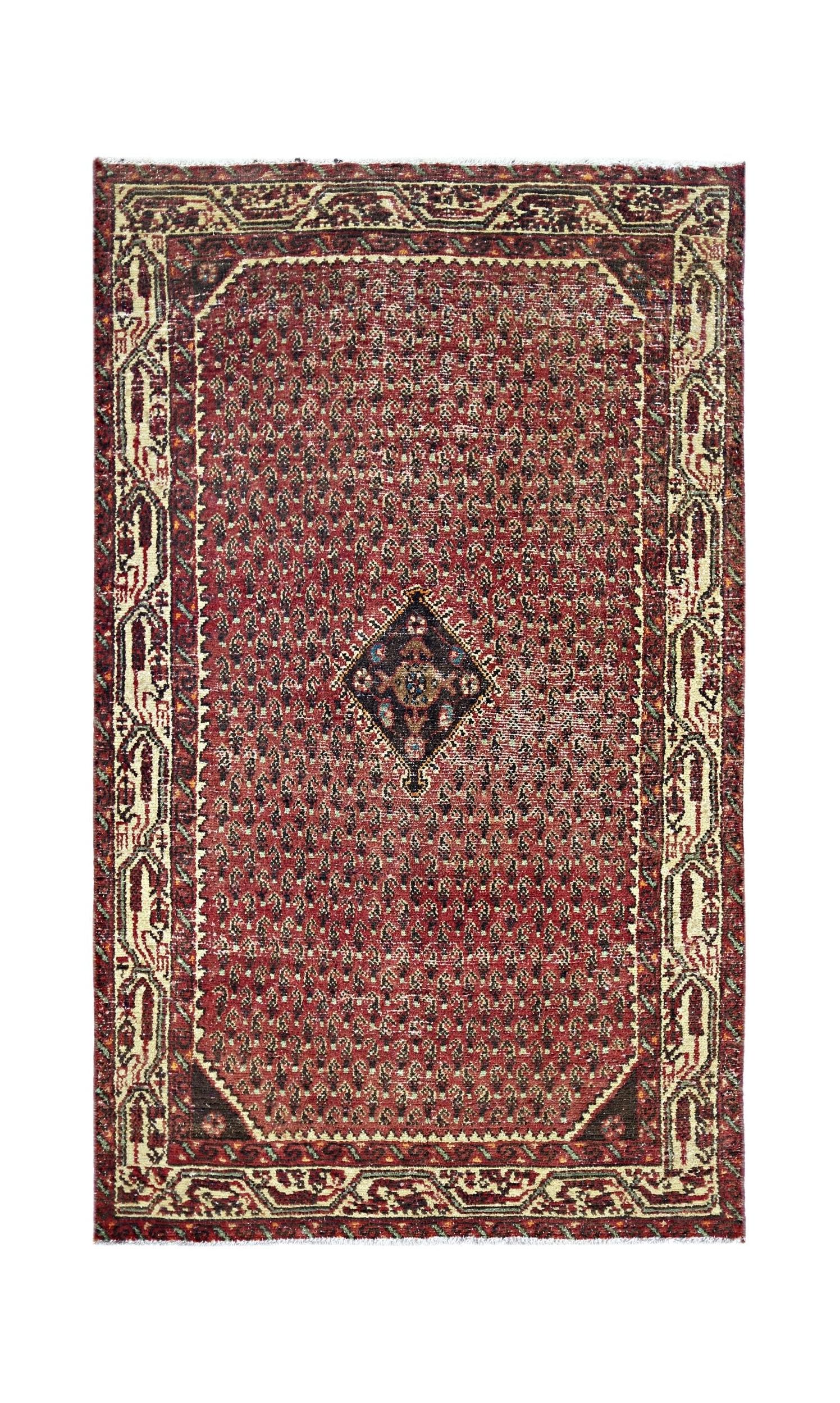 A vintage Persian Saraband rug featuring a red field with a central diamond motif and ornate borders.
