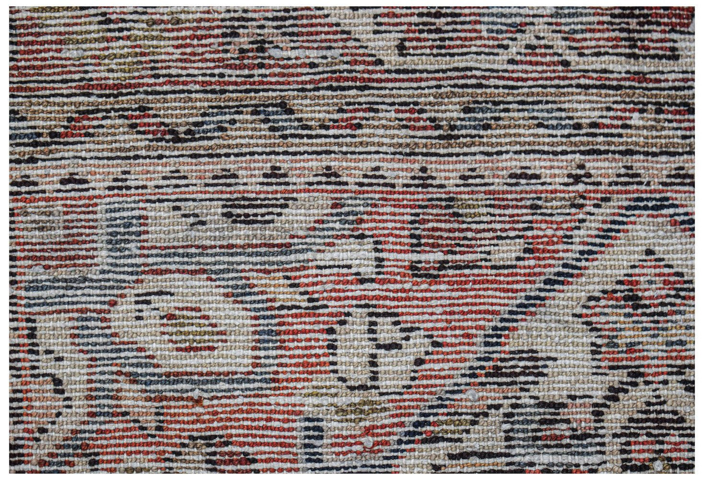 A close-up view of a handwoven vintage Persian rug featuring intricate patterns in red and blue.