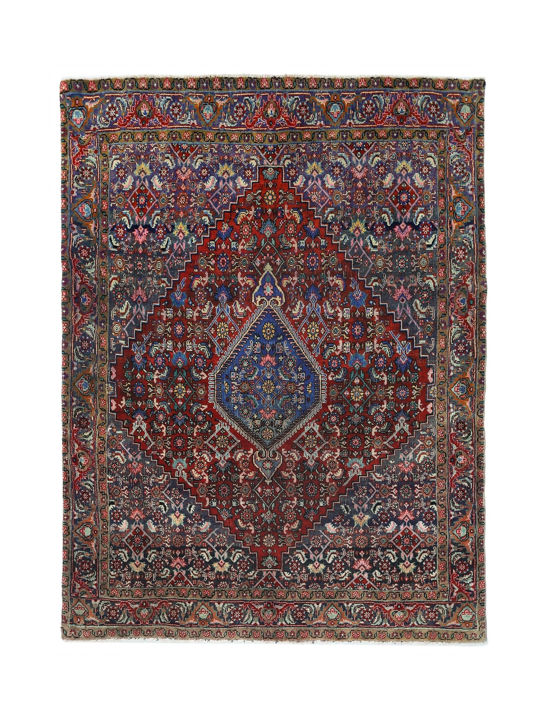 A vintage Persian Senneh rug featuring a central diamond medallion on a deep red and blue field.