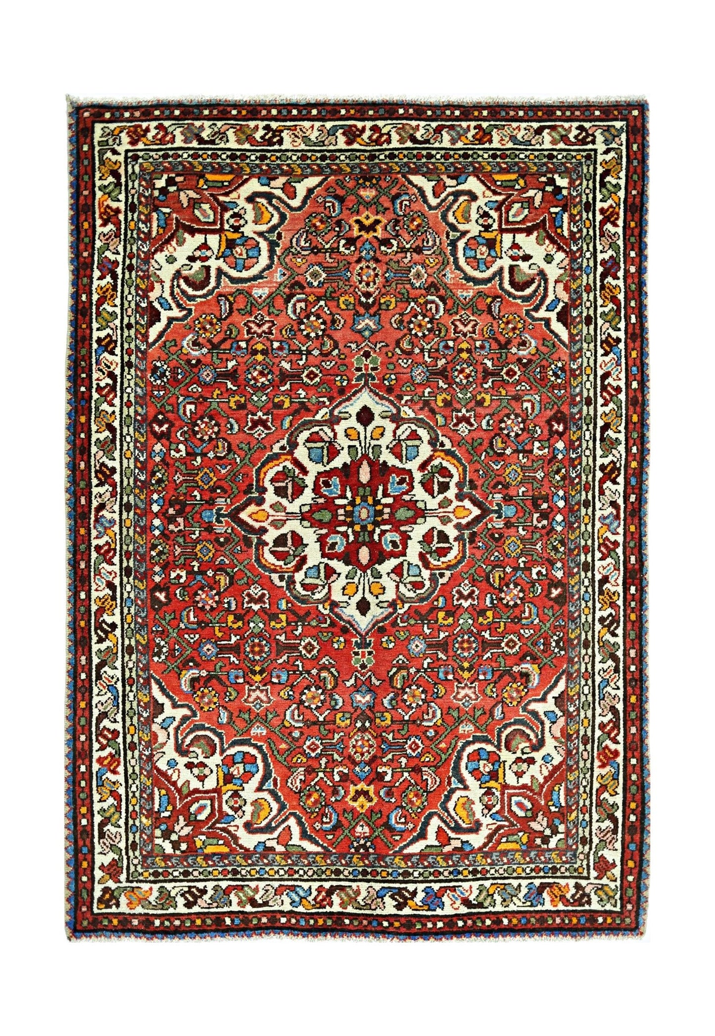A vintage Persian Sarouk rug featuring a central floral medallion on a vibrant red field.