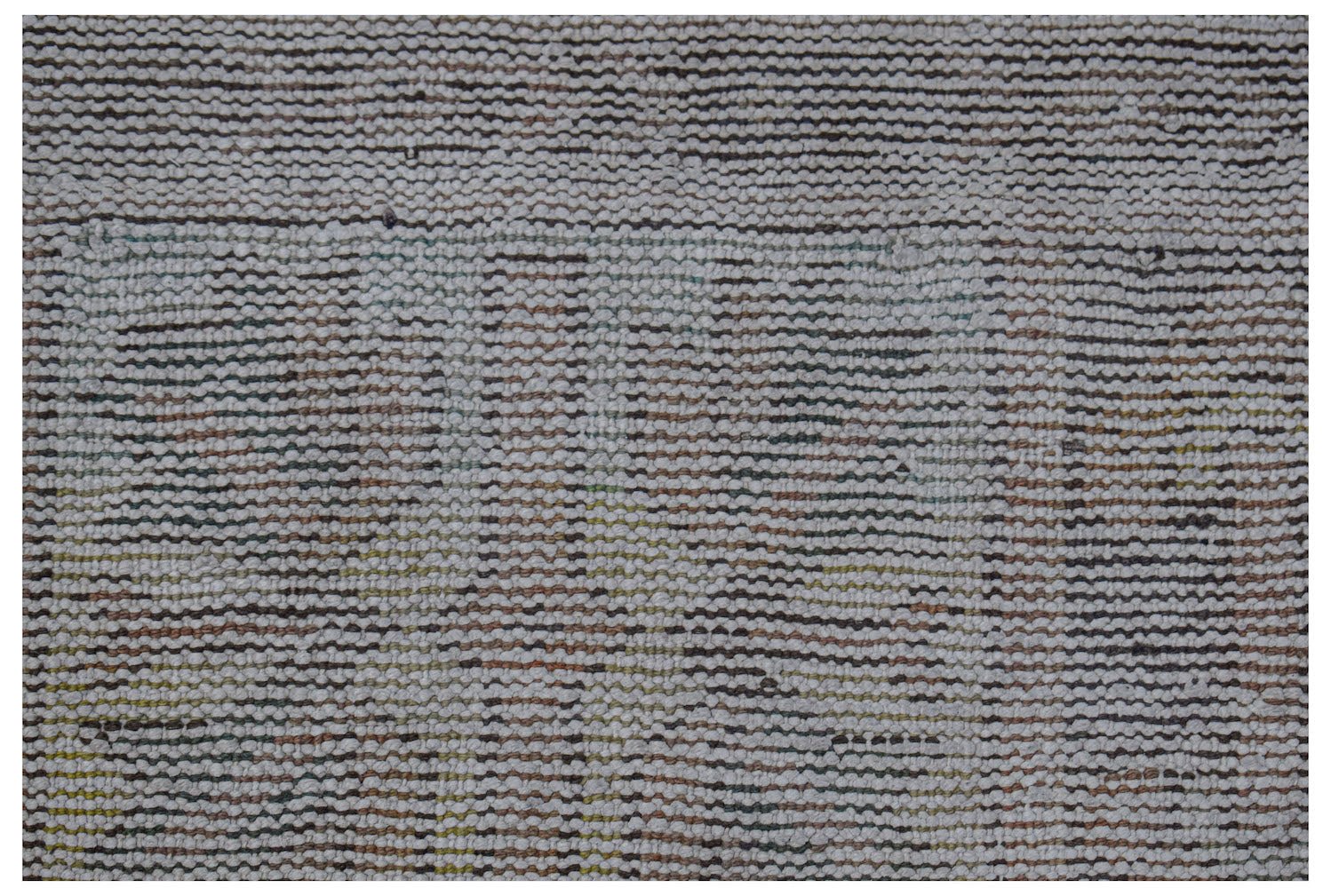 Vintage Persian rug with a textured, striped pattern in muted colors.