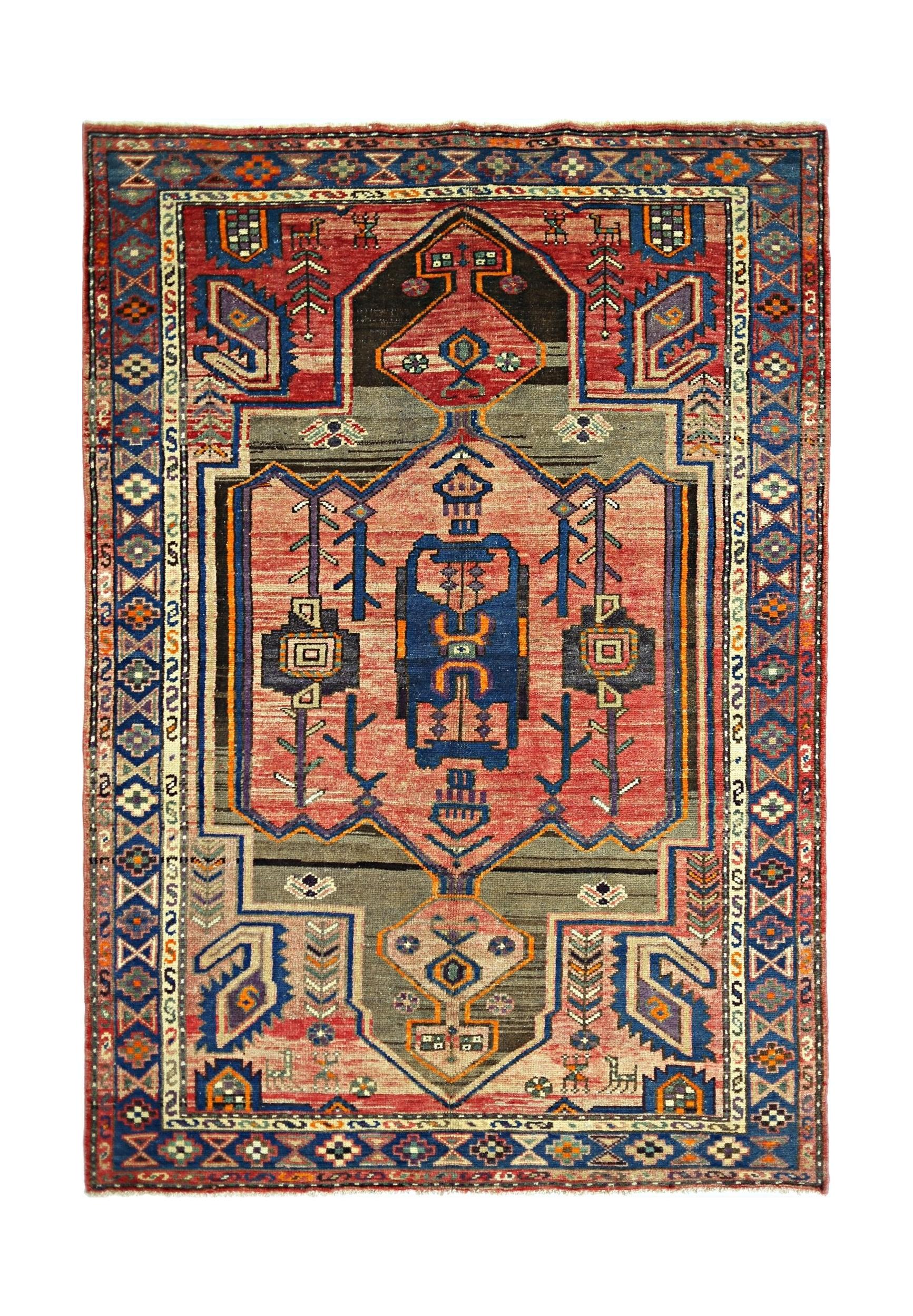 A vintage Persian Hamadan rug featuring a geometric medallion pattern in red, blue, and grey.