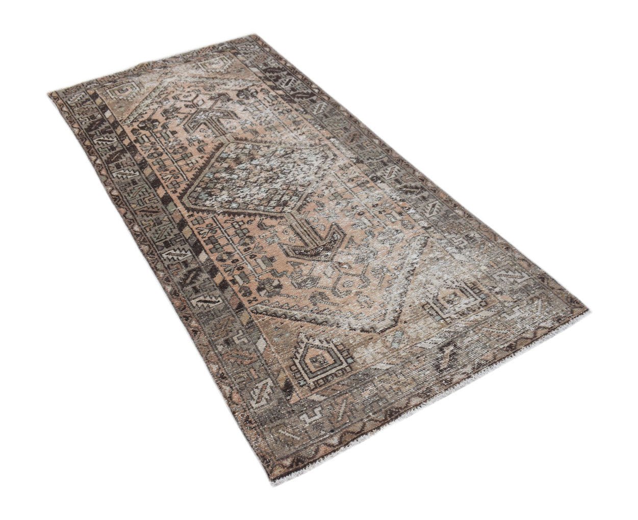 A rectangular vintage Persian rug featuring a faded geometric pattern in shades of brown and beige.