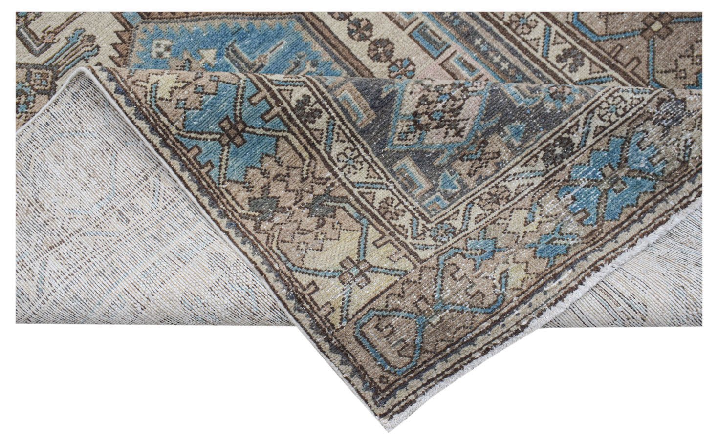 A vintage handwoven Persian rug featuring geometric patterns in shades of blue, brown, and beige.