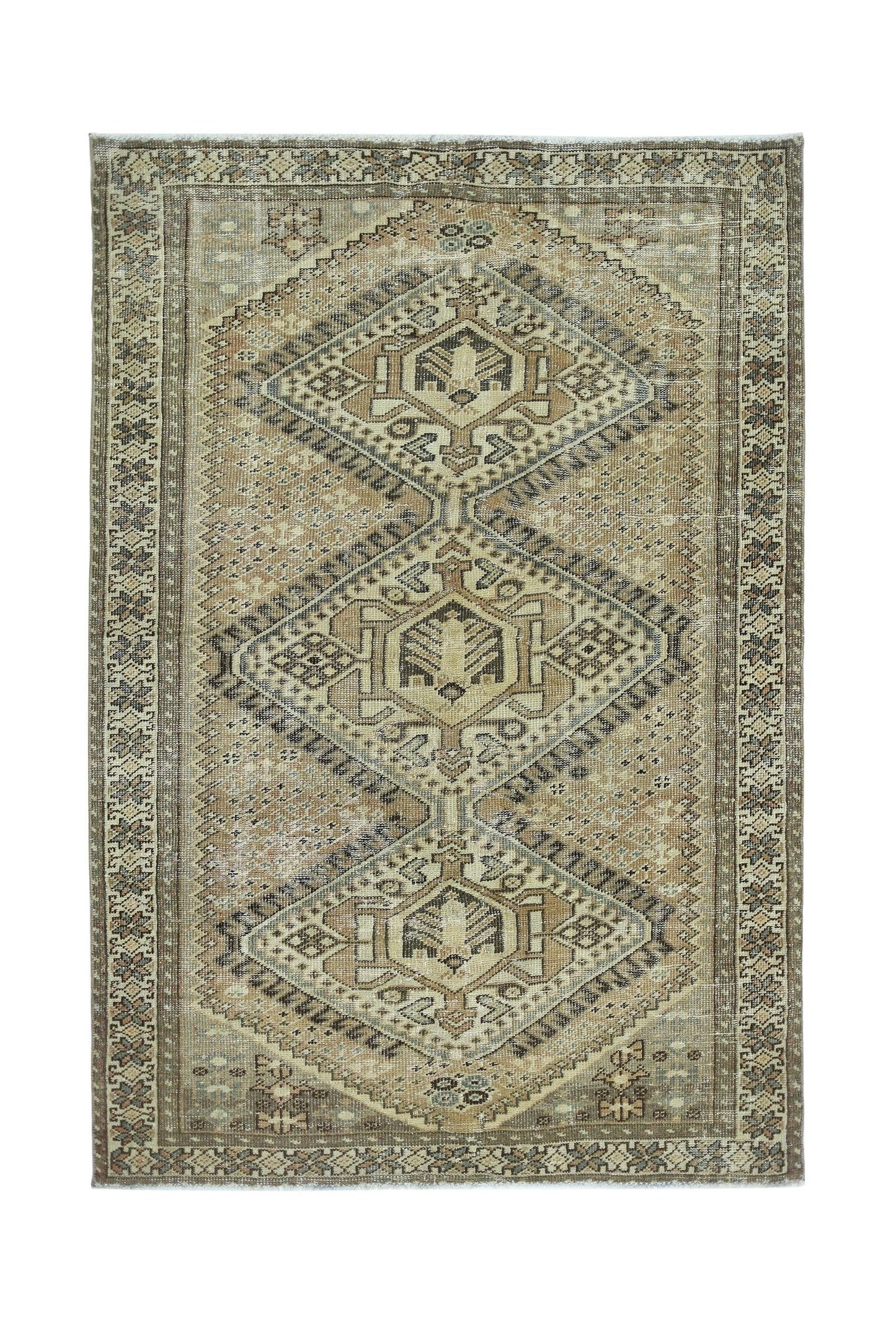 Vintage Persian Qashqai rug featuring a geometric diamond pattern in neutral earth tones.