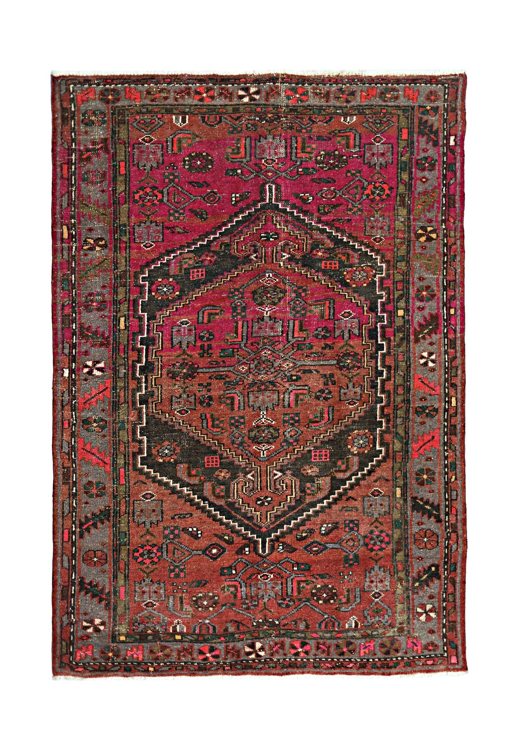 A vintage handmade Persian Hamadan rug featuring a central geometric medallion in red and black.