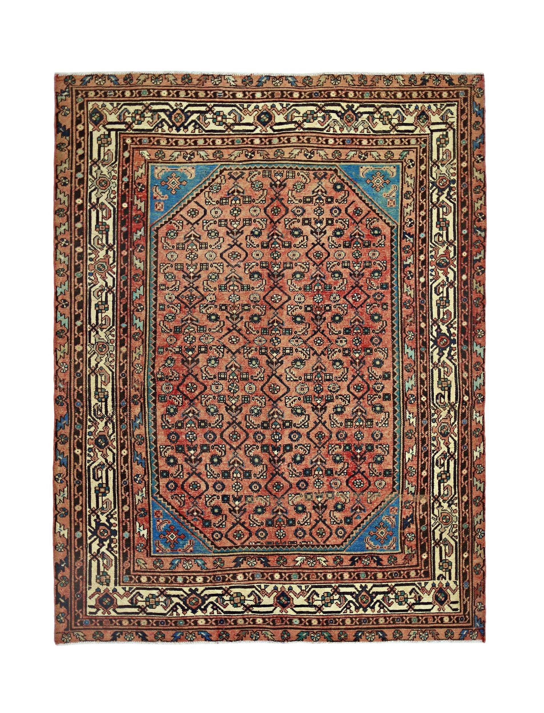 A vintage handmade Persian rug featuring a geometric floral pattern in red and blue tones.