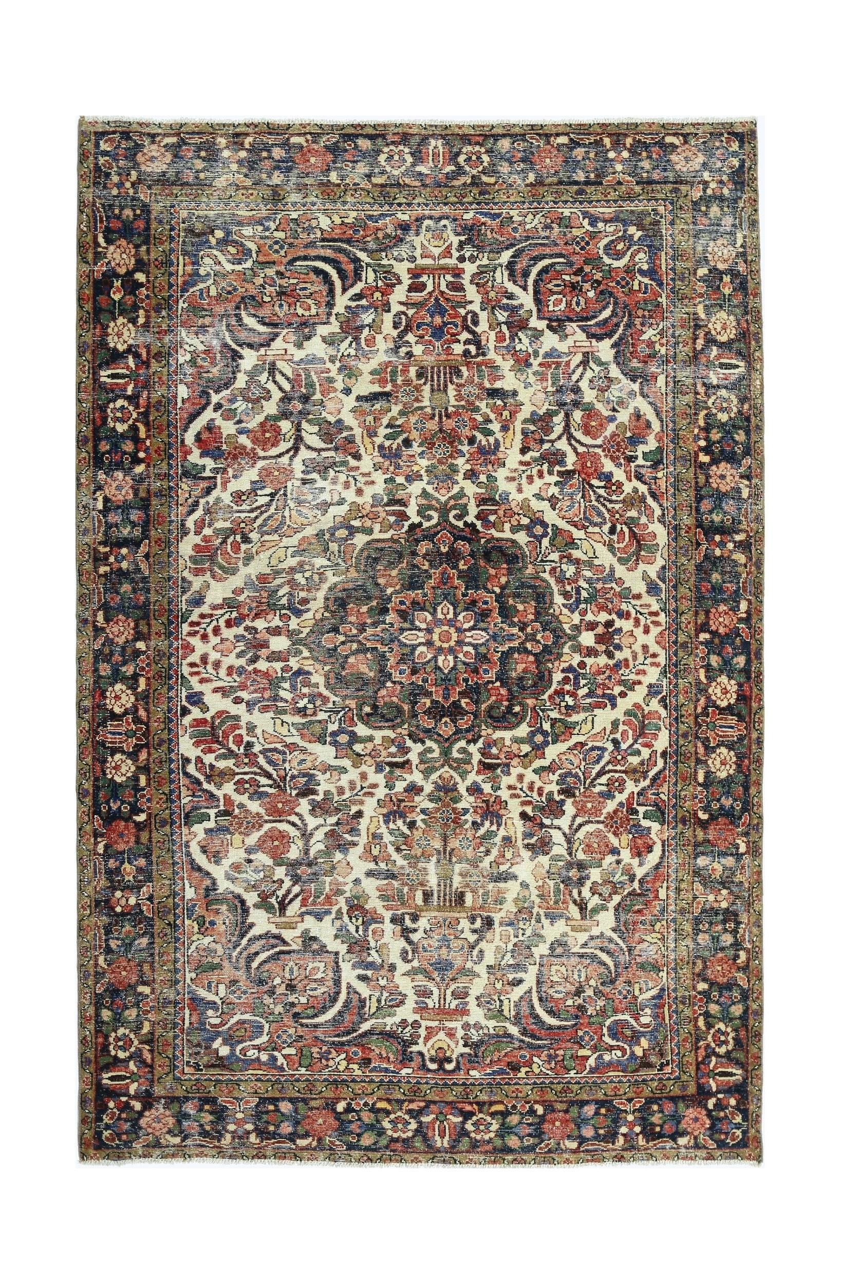 A vintage Persian rug featuring a central floral medallion on a cream field with a dark border.