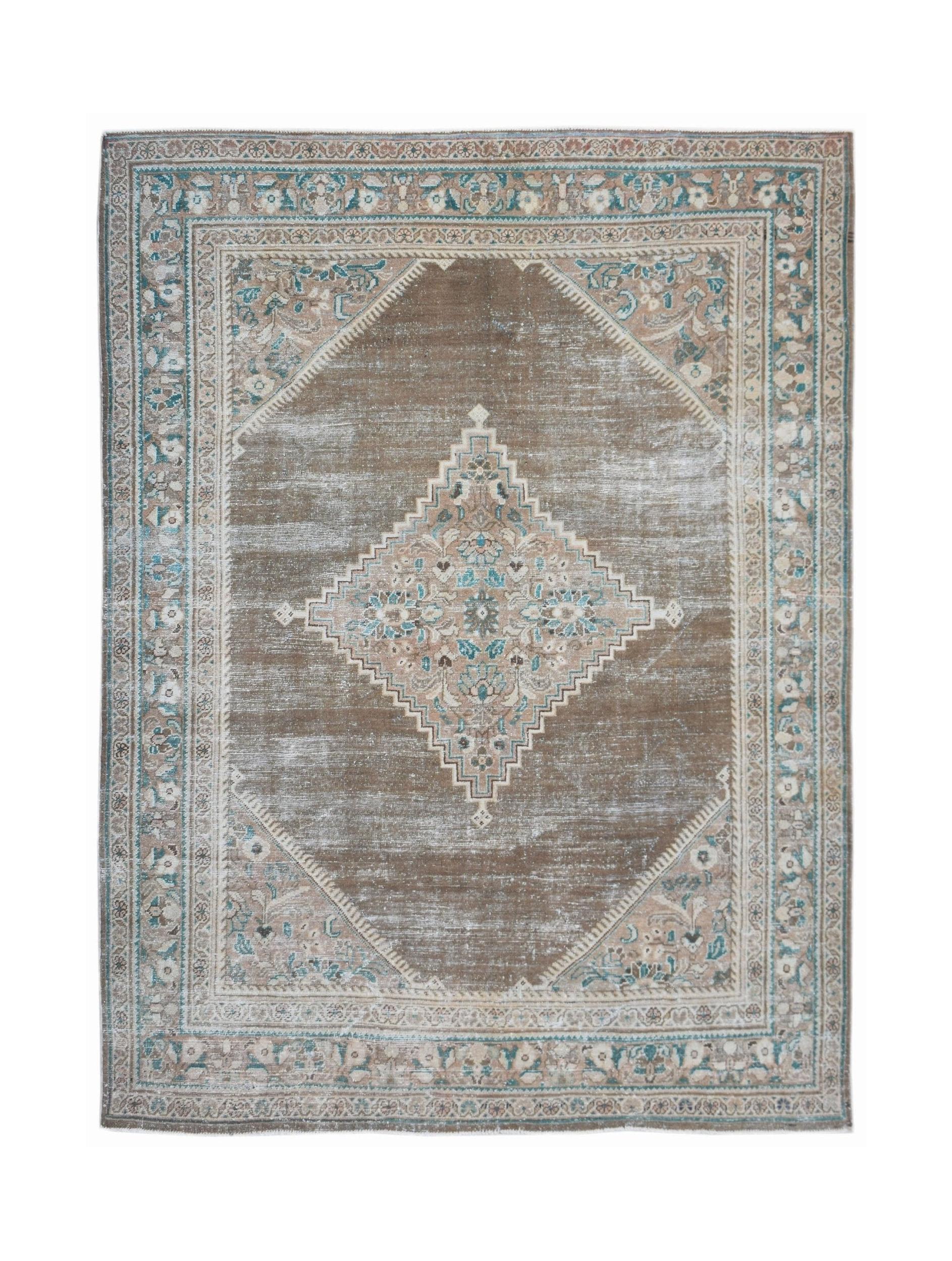 A vintage Persian Mahal rug featuring a central diamond medallion in muted brown and blue tones.