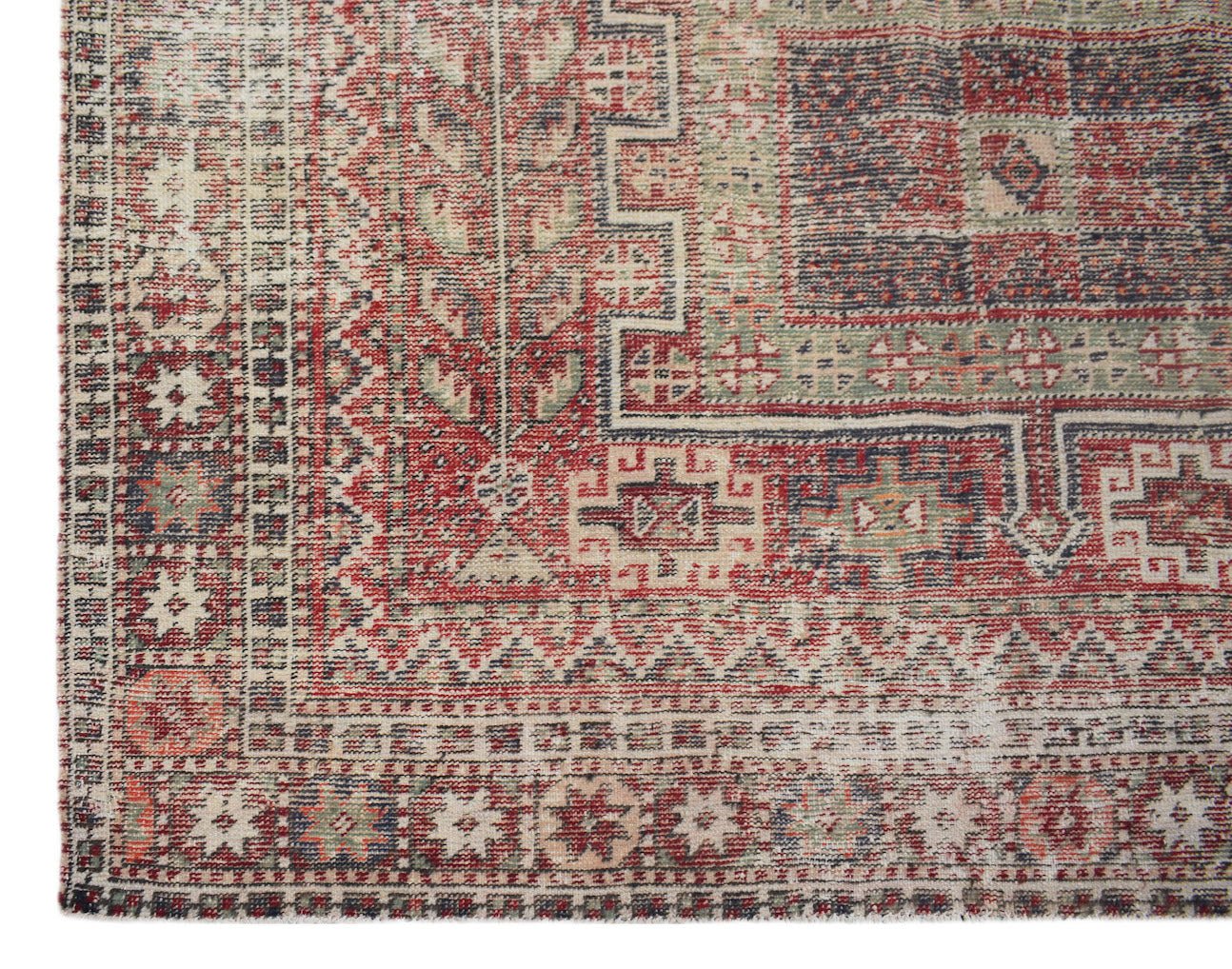 Vintage Persian rug with red, blue, and green geometric patterns.