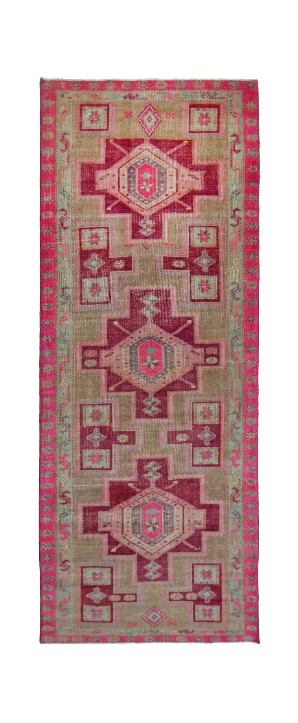 Vintage Persian Hamadan runner featuring geometric medallions in shades of pink and tan.