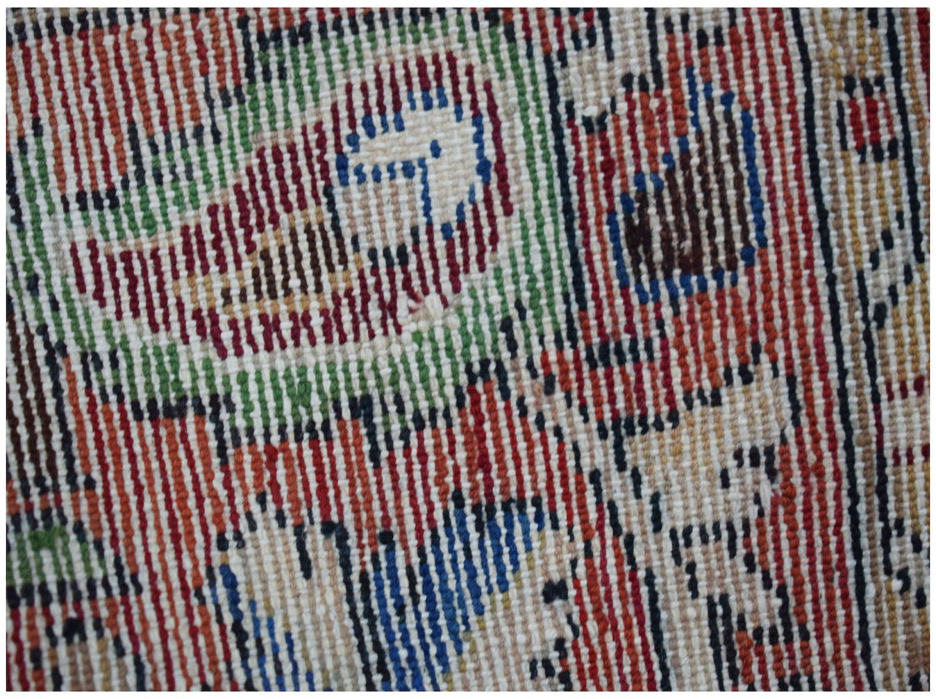 A close-up view of a vintage Persian Sarouk runner featuring intricate handwoven wool patterns.