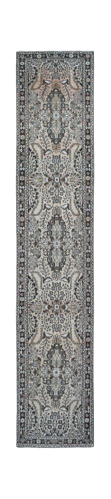 A vintage Persian Sarouk runner featuring a floral medallion pattern in muted earth tones.