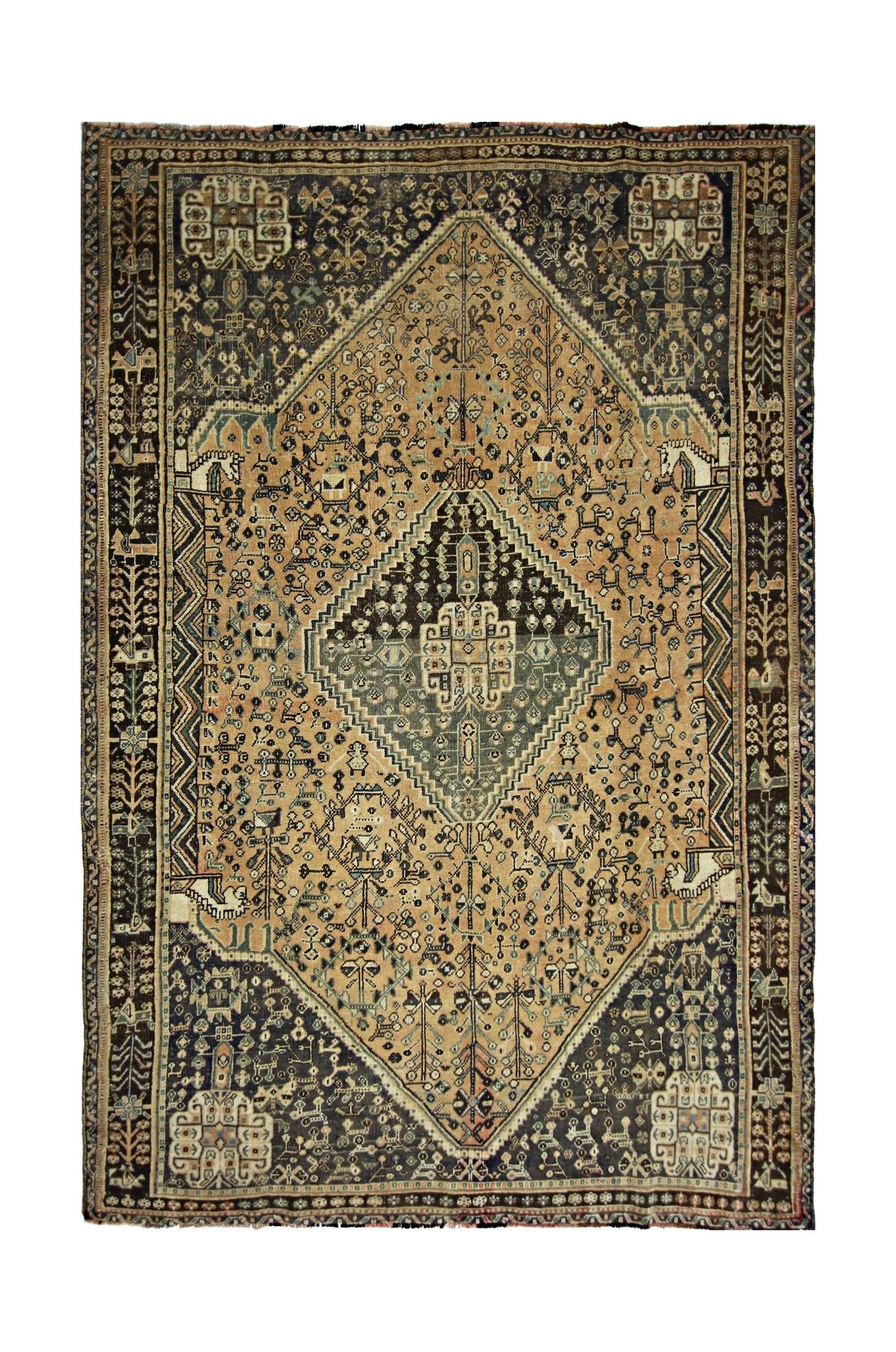 A vintage Persian Shiraz rug featuring a large central diamond medallion on a tan field.