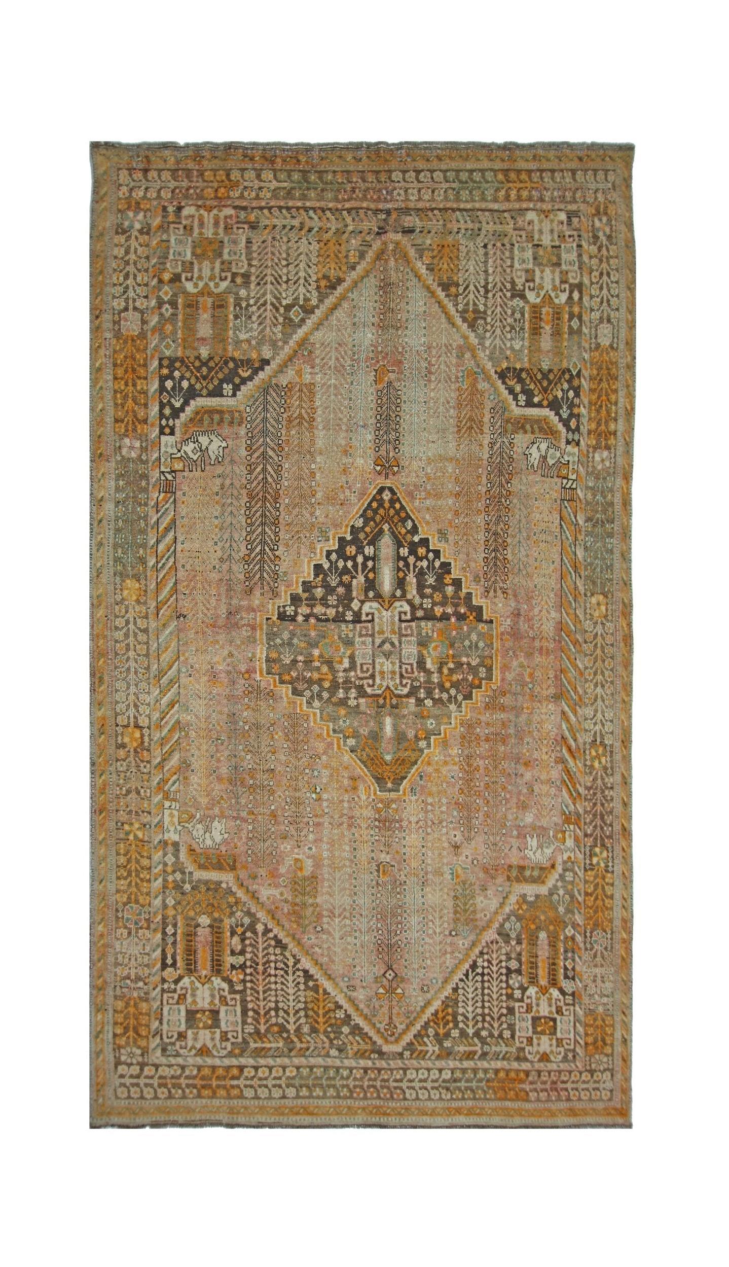 A vintage Persian Shiraz rug featuring a central geometric medallion on a muted orange field.