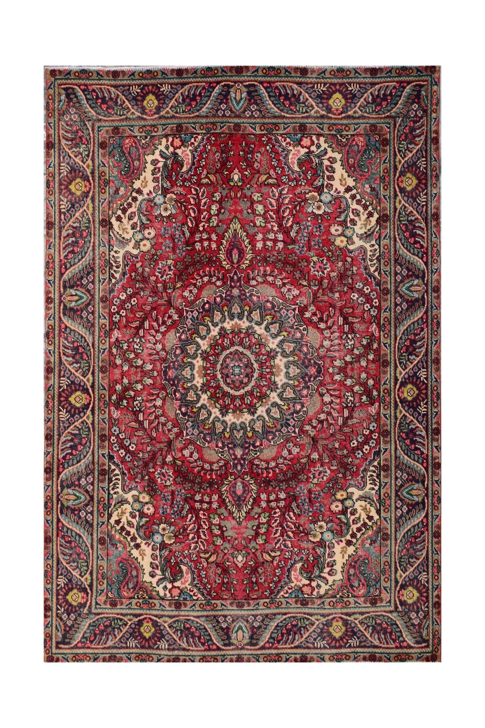 A vintage Persian Tabriz rug featuring a central medallion and intricate floral patterns in red.