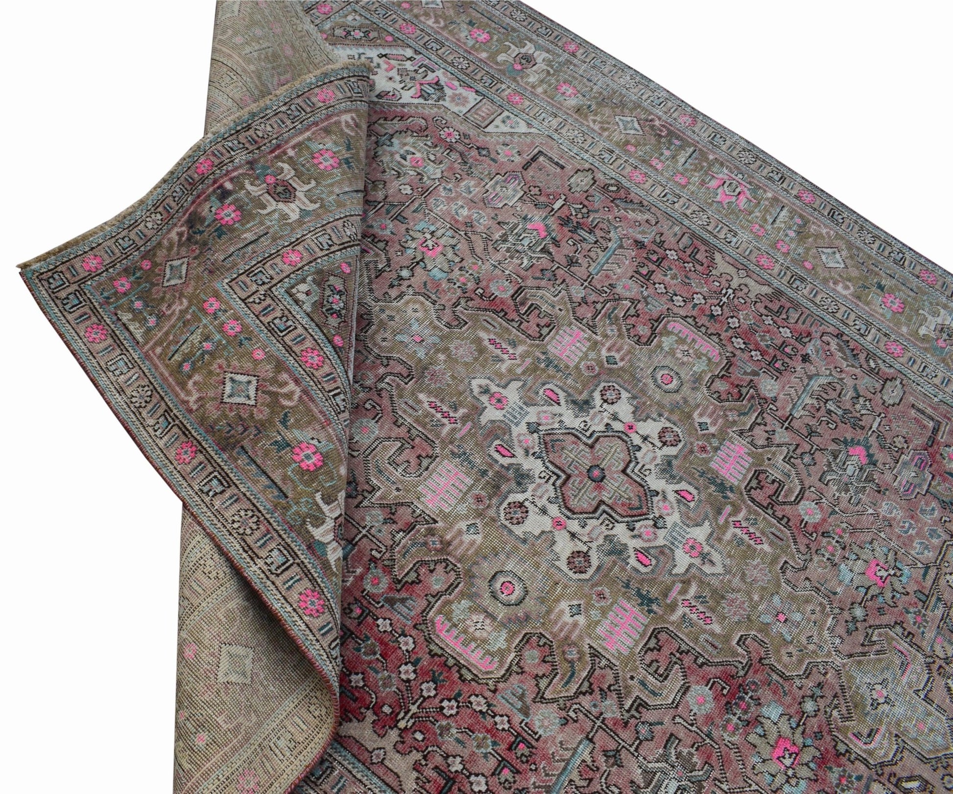 A vintage handwoven Persian Tabriz rug featuring intricate floral patterns in muted earth tones.