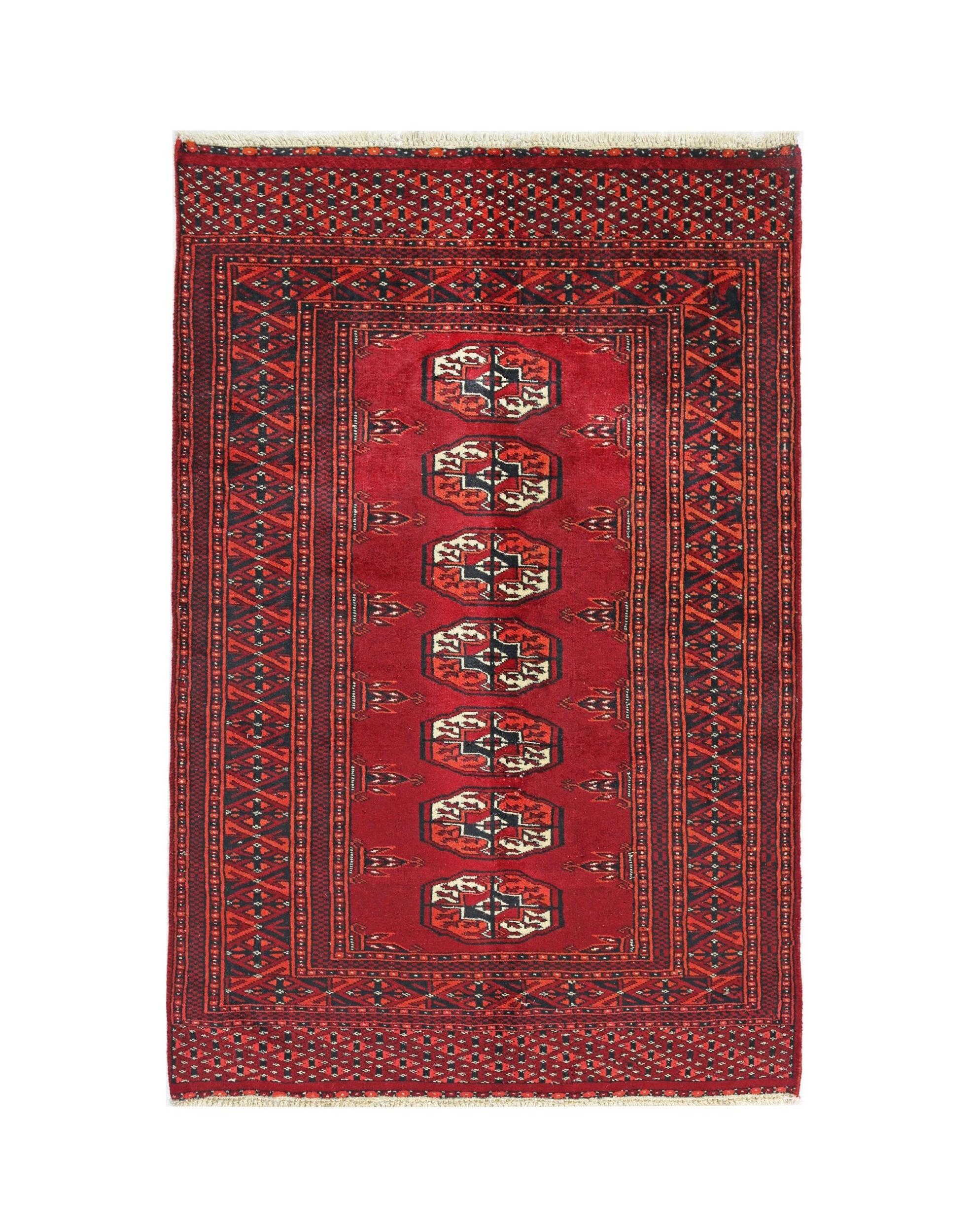 A vintage Pakistani Princess Bokhara rug featuring a red field with repeating octagonal motifs.