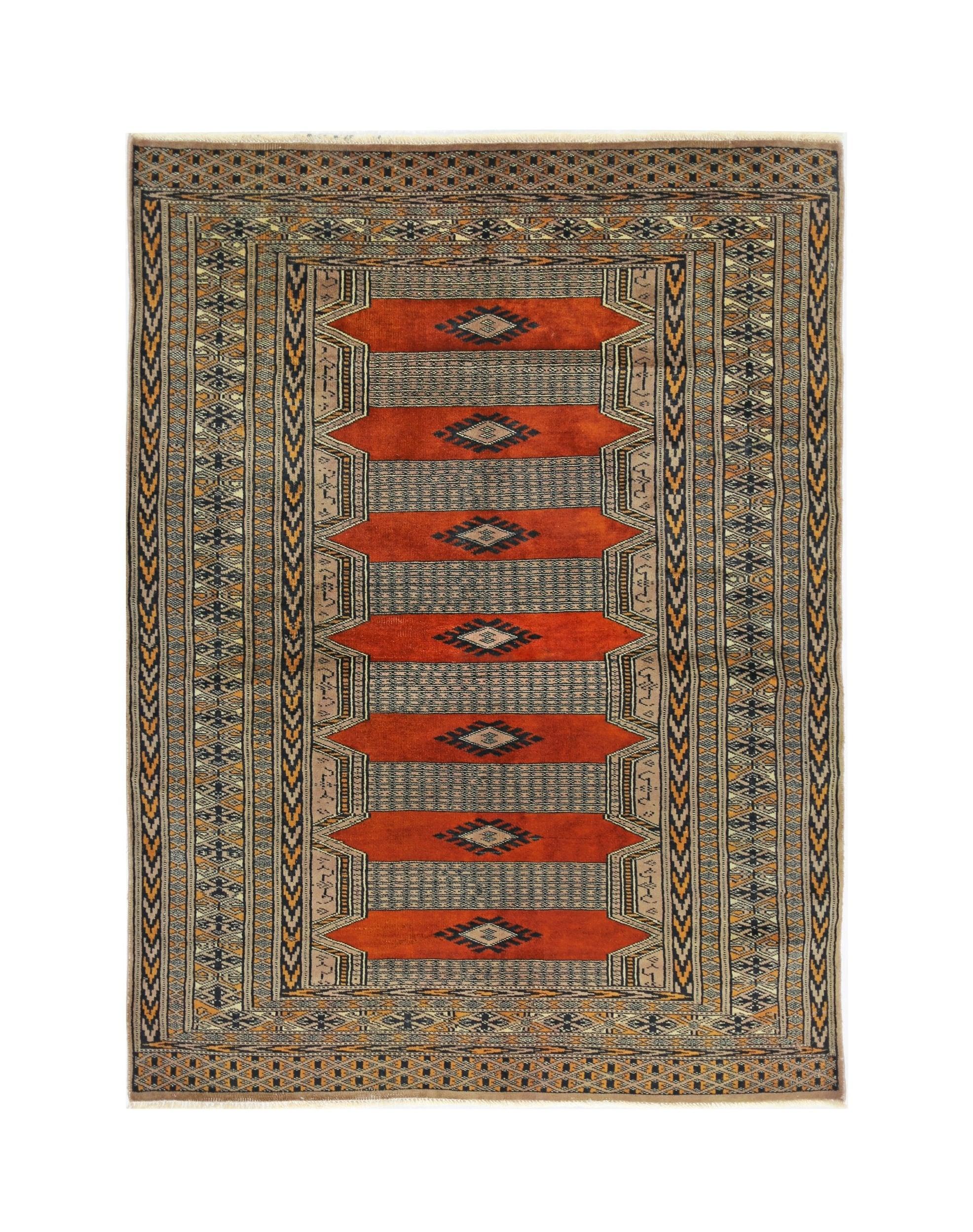 A vintage Pakistani Princess Bokhara rug featuring repeating geometric diamond motifs in red and grey.