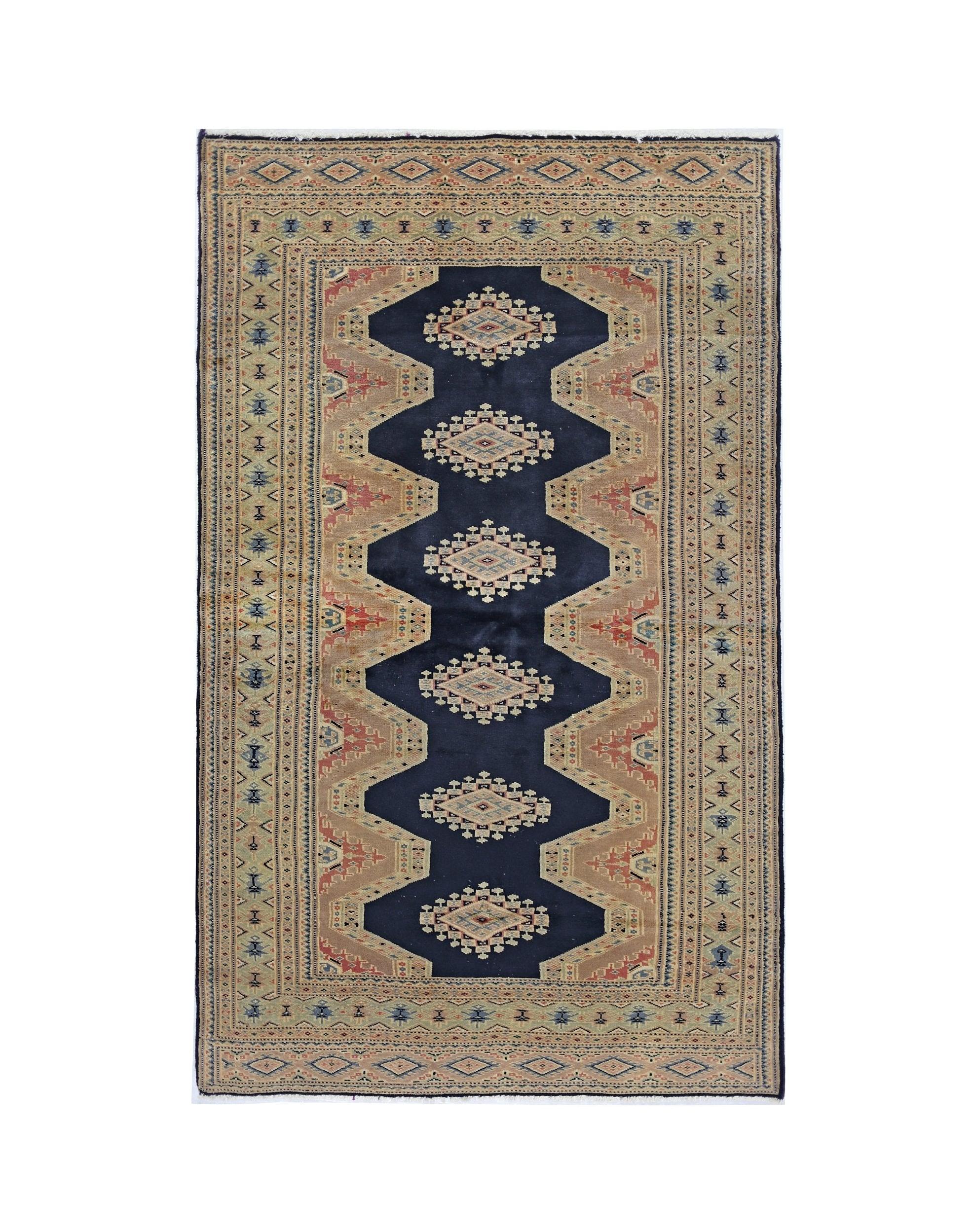 Vintage Pakistani Princess Bokhara rug featuring a dark blue central field with geometric motifs.