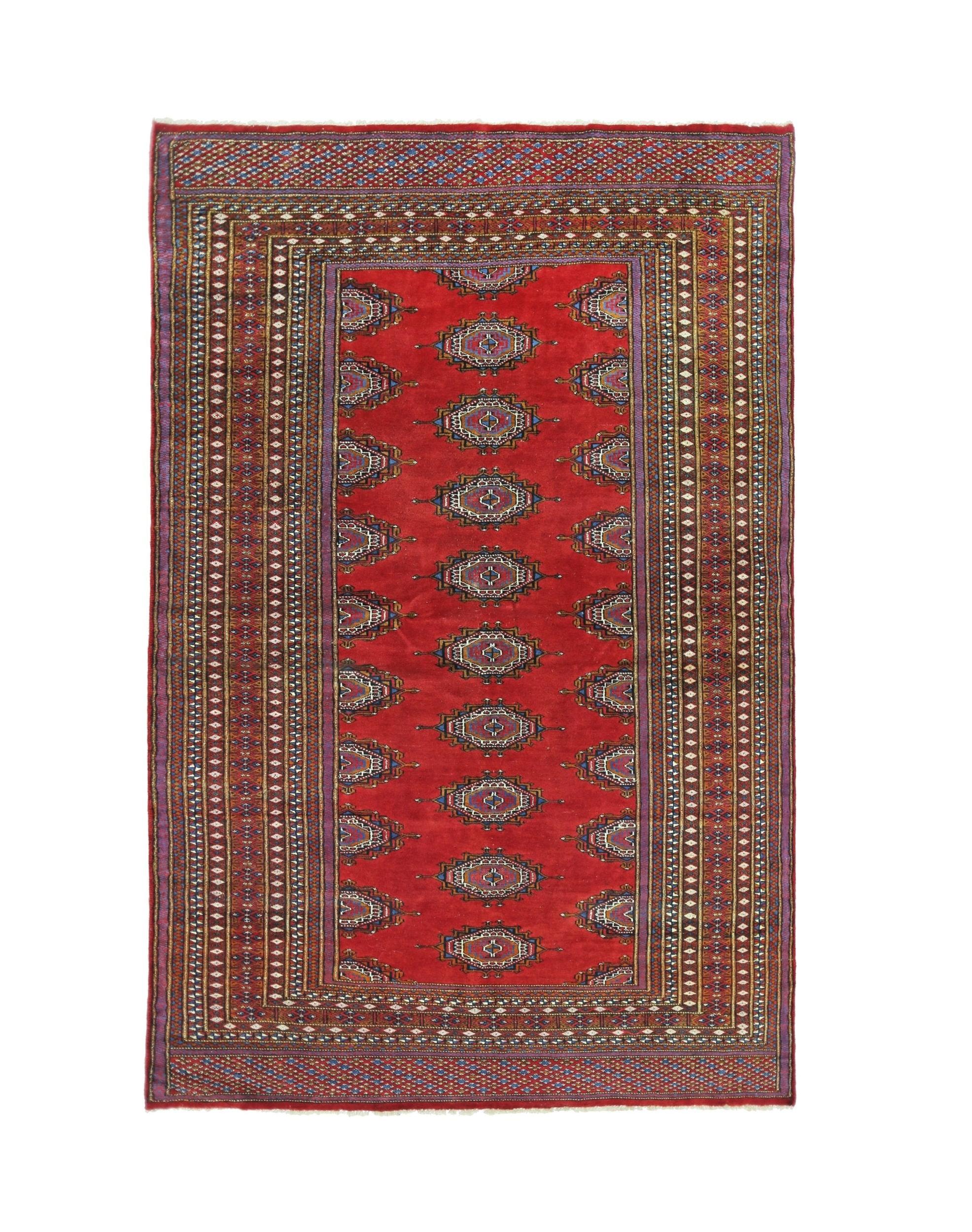 A vintage Pakistani Princess Bokhara rug featuring a red field with repeating geometric motifs.