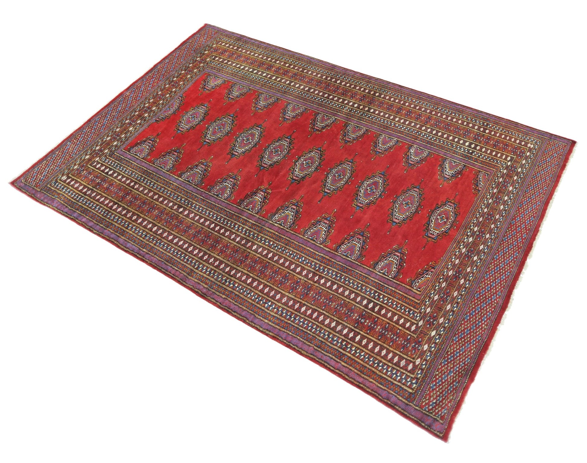 A vintage Pakistani Princess Bokhara rug featuring a red field with repeating geometric motifs.