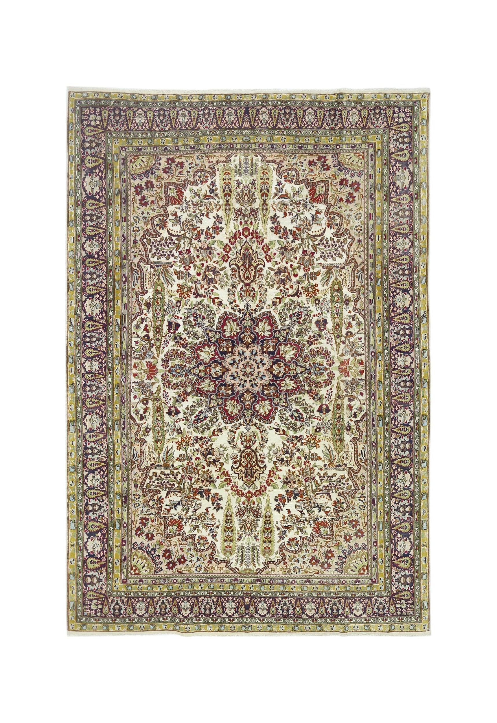 A vintage Turkish Kayseri rug featuring a central floral medallion on a cream field with ornate borders.