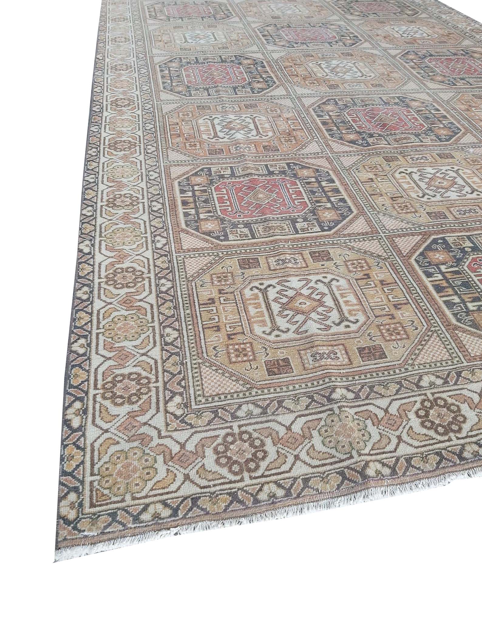 A vintage handmade Turkish Oushak rug featuring a geometric pattern of octagonal medallions.