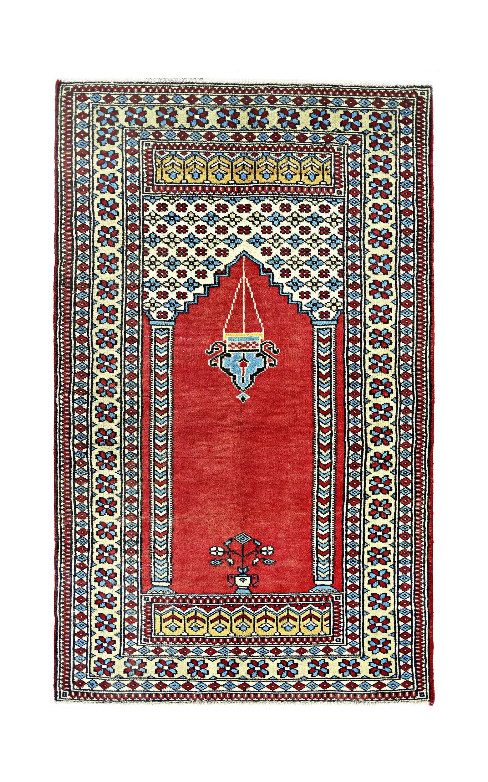 A vintage handmade Turkish Kayseri prayer rug featuring a red mihrab design with floral motifs.